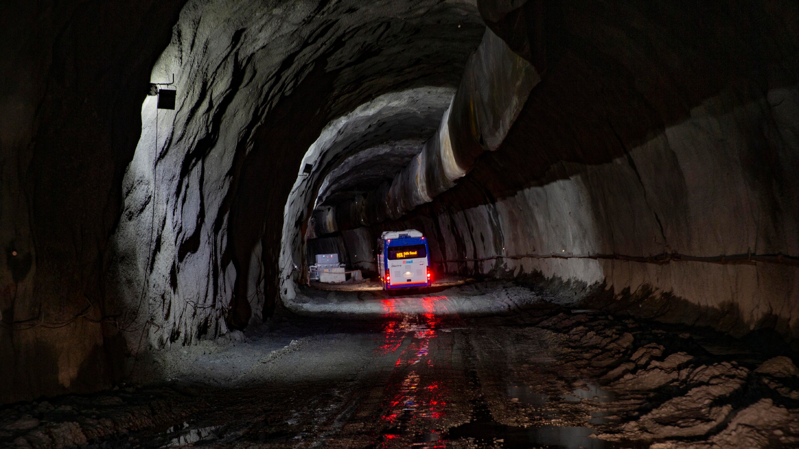 FILE -A bus carrying journalists takes a tour of the under construction Z-Morh tunnel in Sonamarg, northeast of Srinagar, Indian controlled Kashmir, Sept. 28, 2021. (AP Photo/Dar Yasin, File)