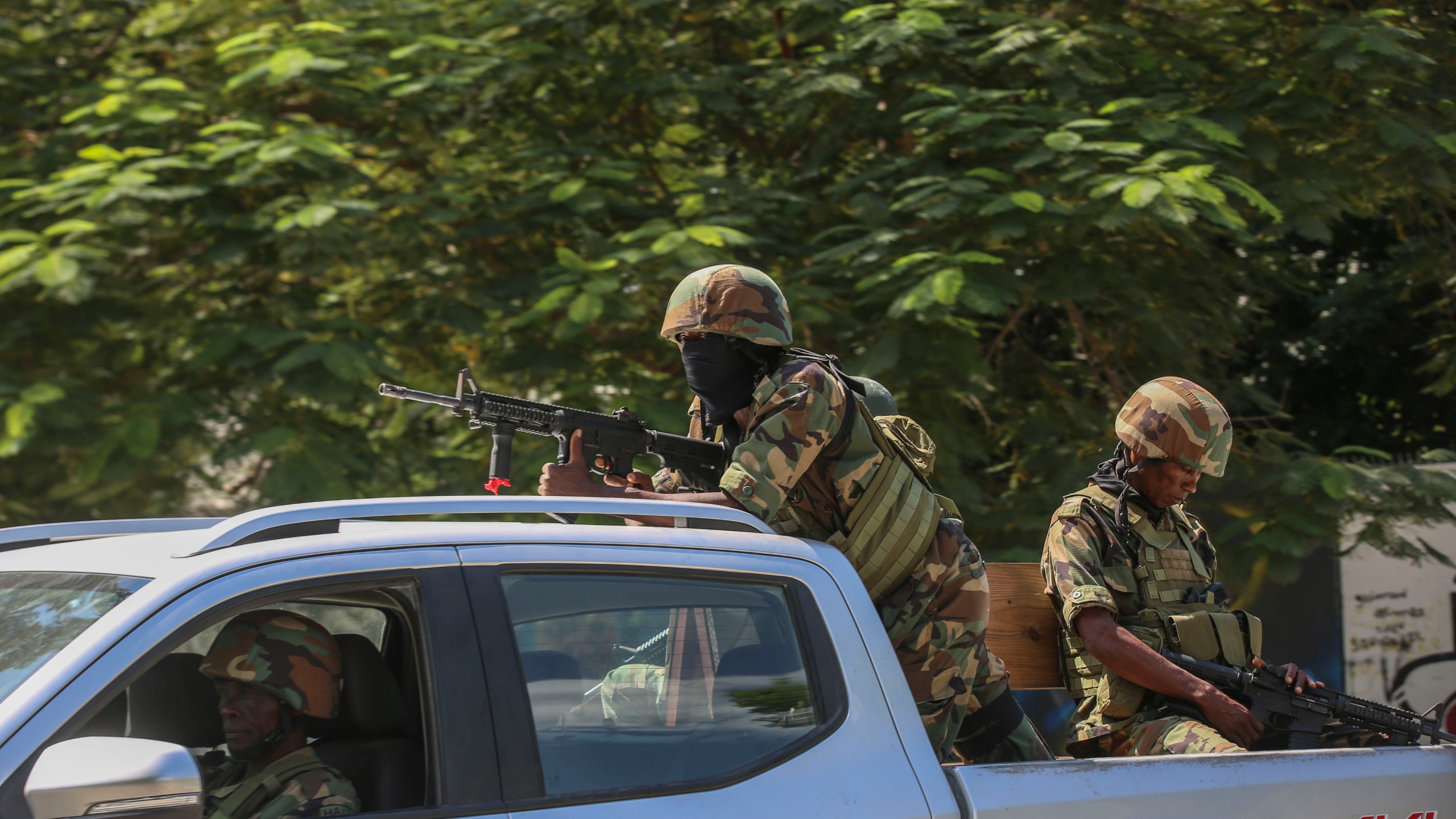 Soldiers patrol amid the sound of gunshots heard in the distance, in Port-au-Prince, Haiti, Thursday, Oct. 17, 2024. (AP Photo/Odelyn Joseph)