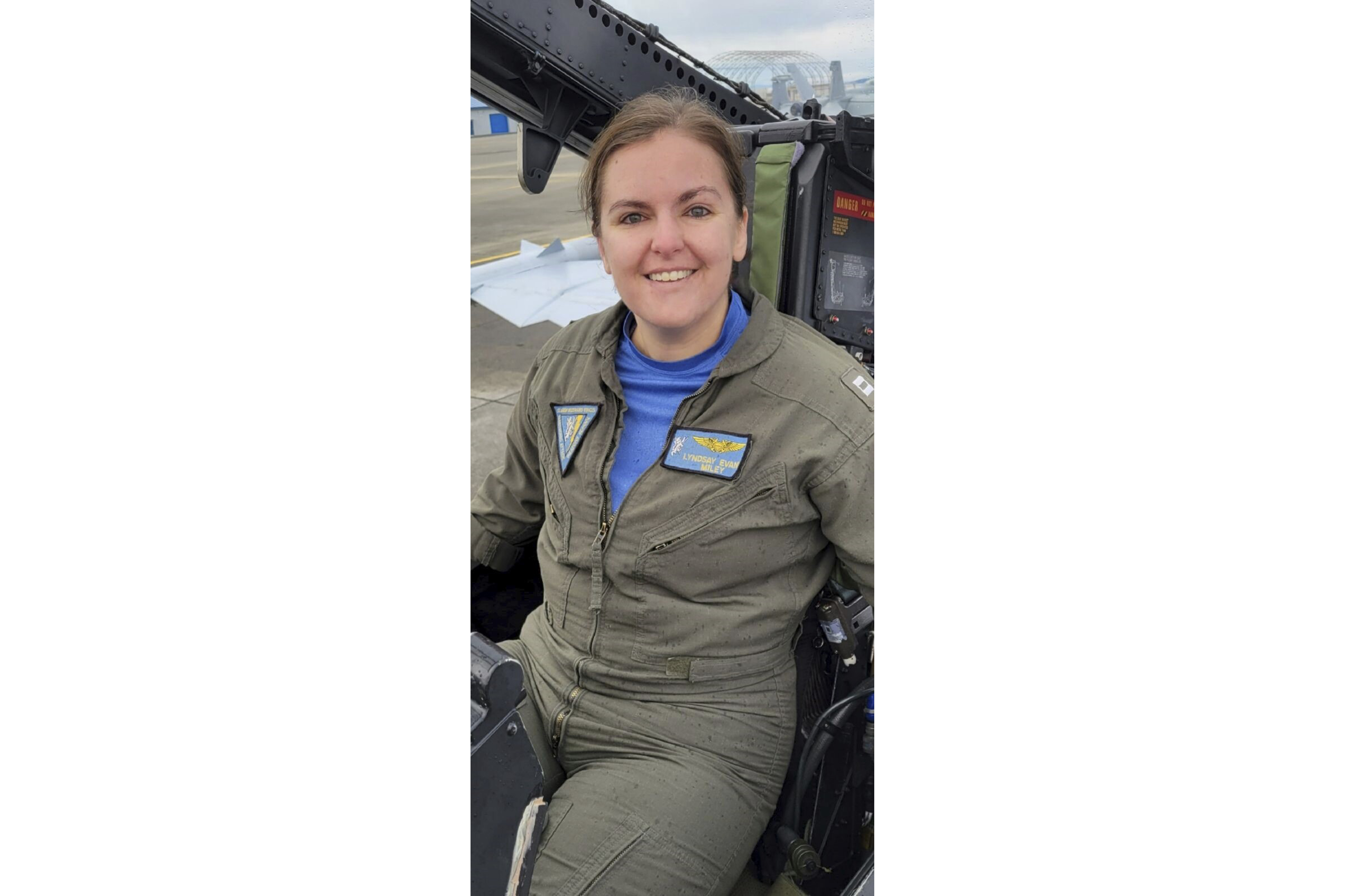 In this undated photo released by the U.S. Navy, Lt. Commander Lyndsay Evans, a Naval Flight Officer, sits in a cockpit. (U.S. Navy via AP)