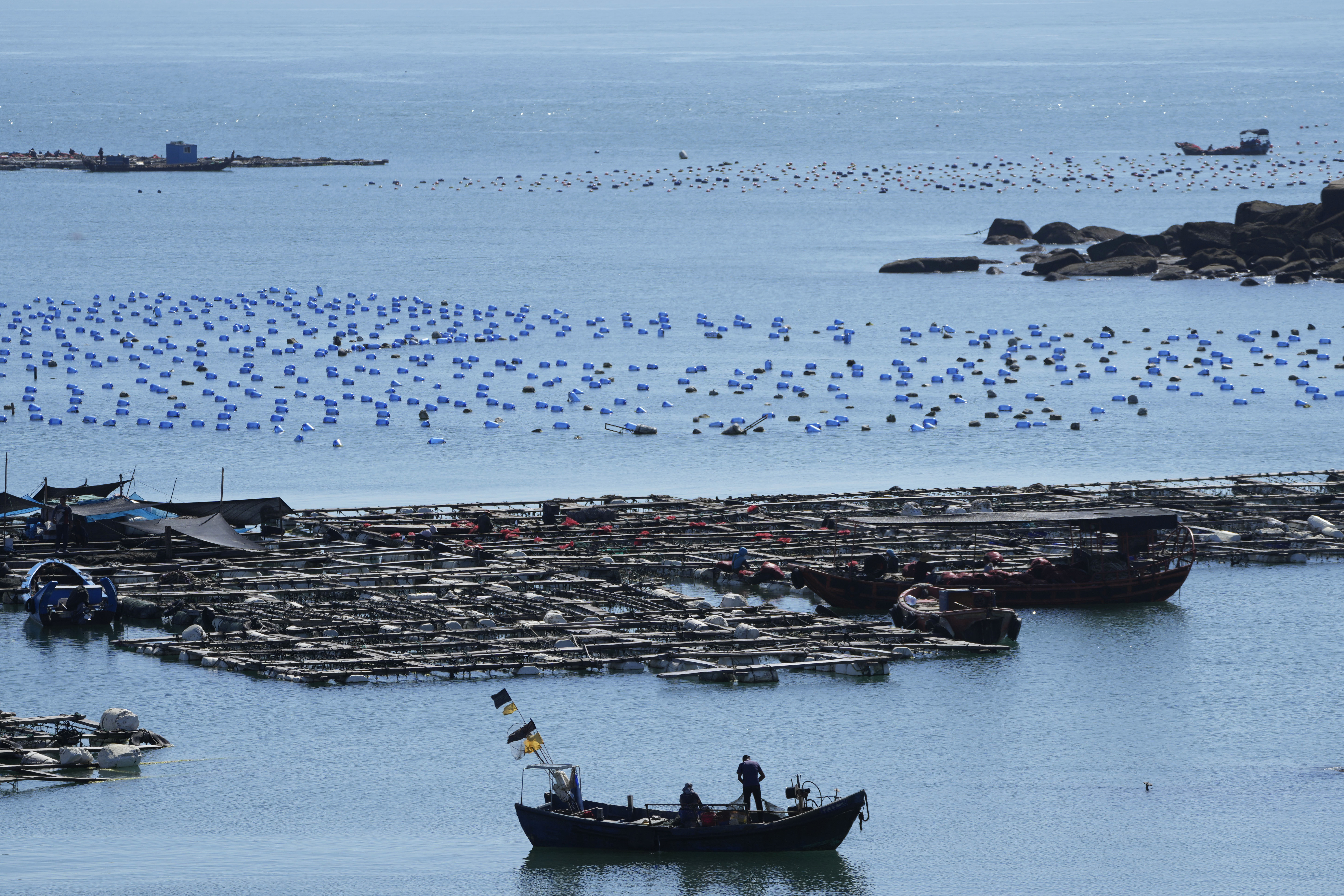 FILE - A boat moves through the water at the 68-nautical-mile scenic spot, the closest point in mainland China to the island of Taiwan, in Pingtan in southeastern China's Fujian Province, on Aug. 5, 2022. (AP Photo/Ng Han Guan, File)