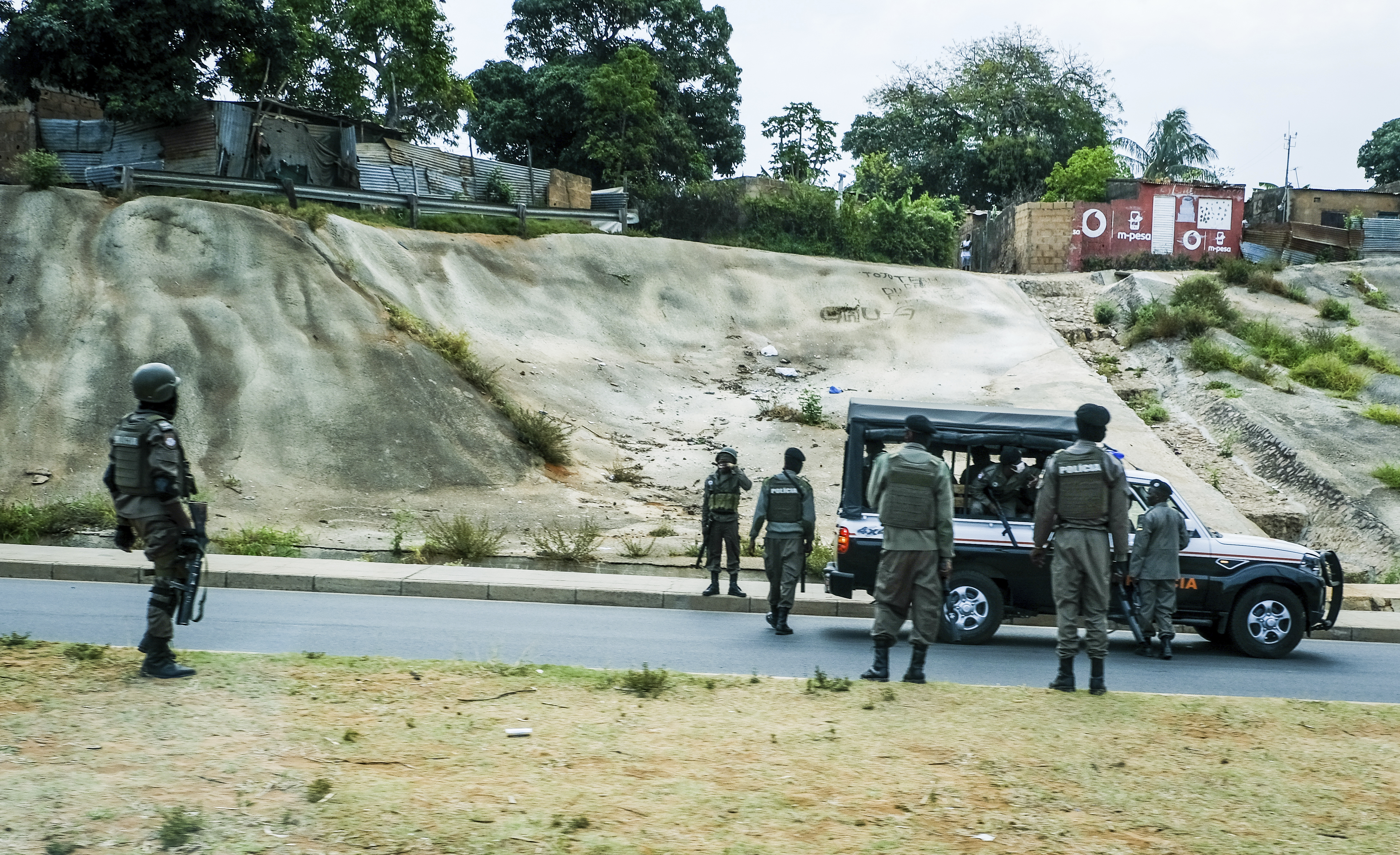 Mozambican police deploys in the streets of Maputo, Mozambique, Monday, Oct. 21, 2024, during a nationwide shutdown protest following a disputed Oct. 9 election. (AP Photo/Carlos Uqueio)