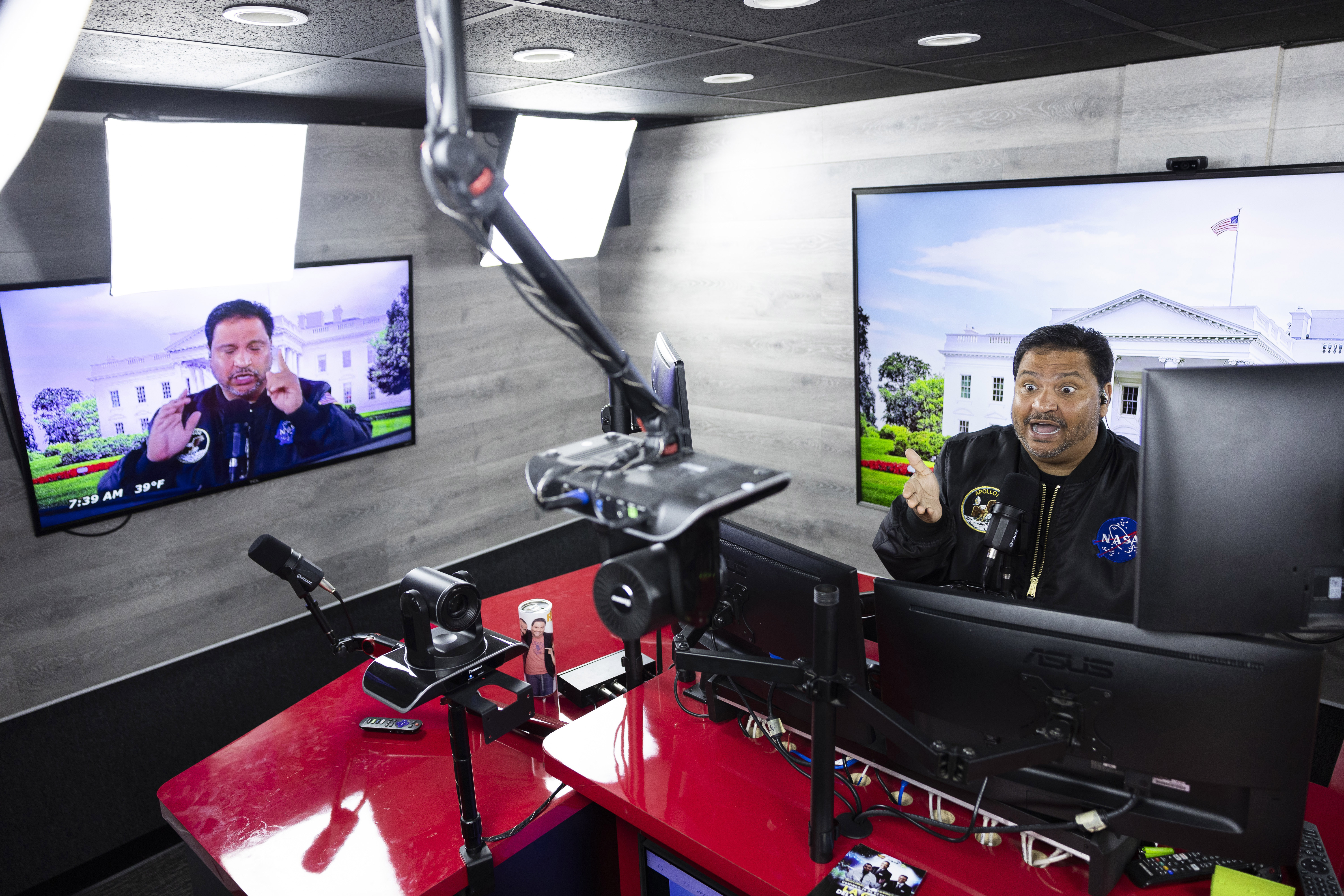 Radio host and owner of radio station La Mega 101.7 FM Victor Martinez on the air in Allentown, Pa., Tuesday, Oct. 15, 2024. (AP Photo/Ryan Collerd)