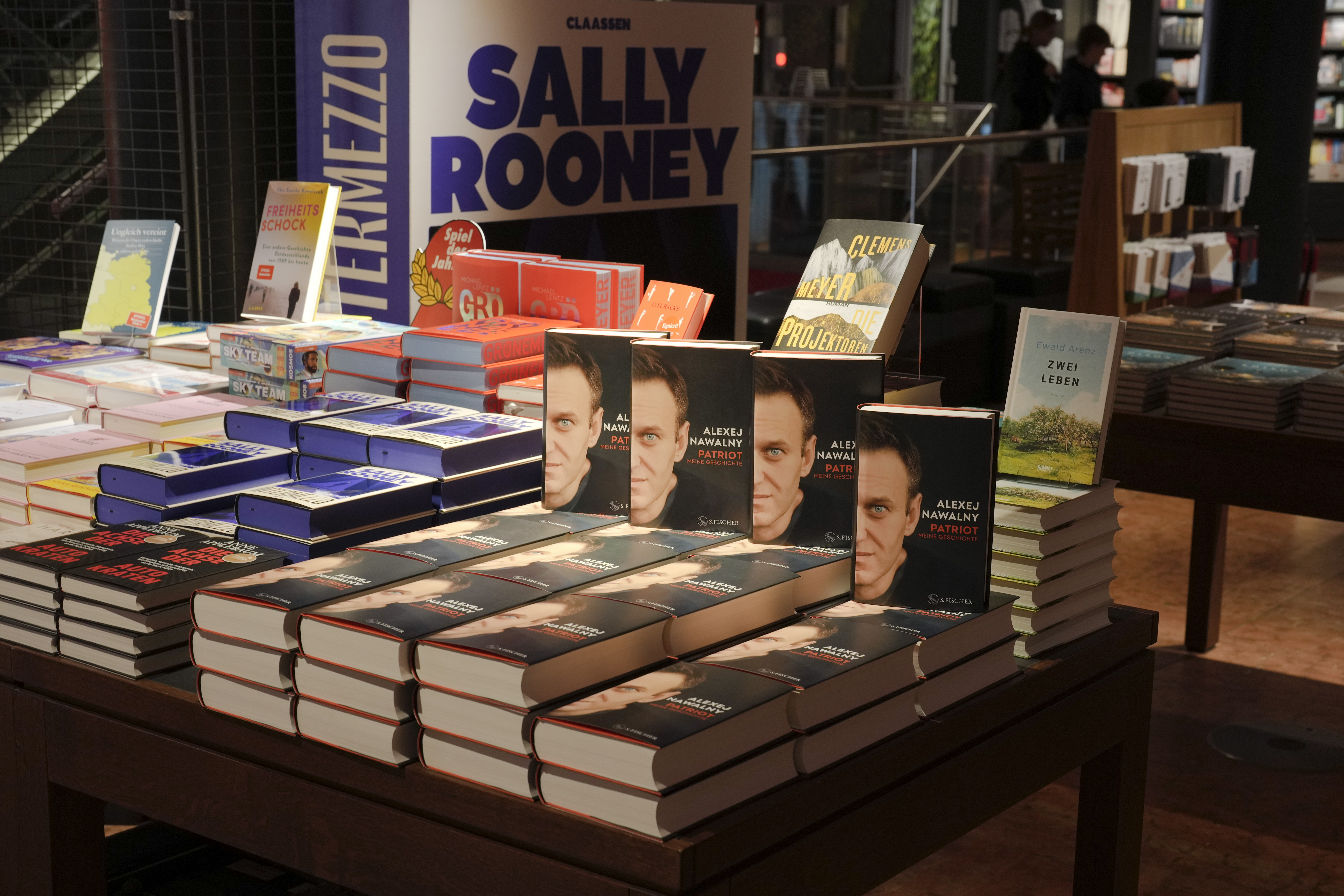 Copies of the late Russian opposition leader Alexei Navalny's memoir entitled 'Patriot' are put display on the first day of sale in a bookshop in Berlin, Germany, Tuesday, Oct. 22, 2024. (AP Photo/Markus Schreiber)