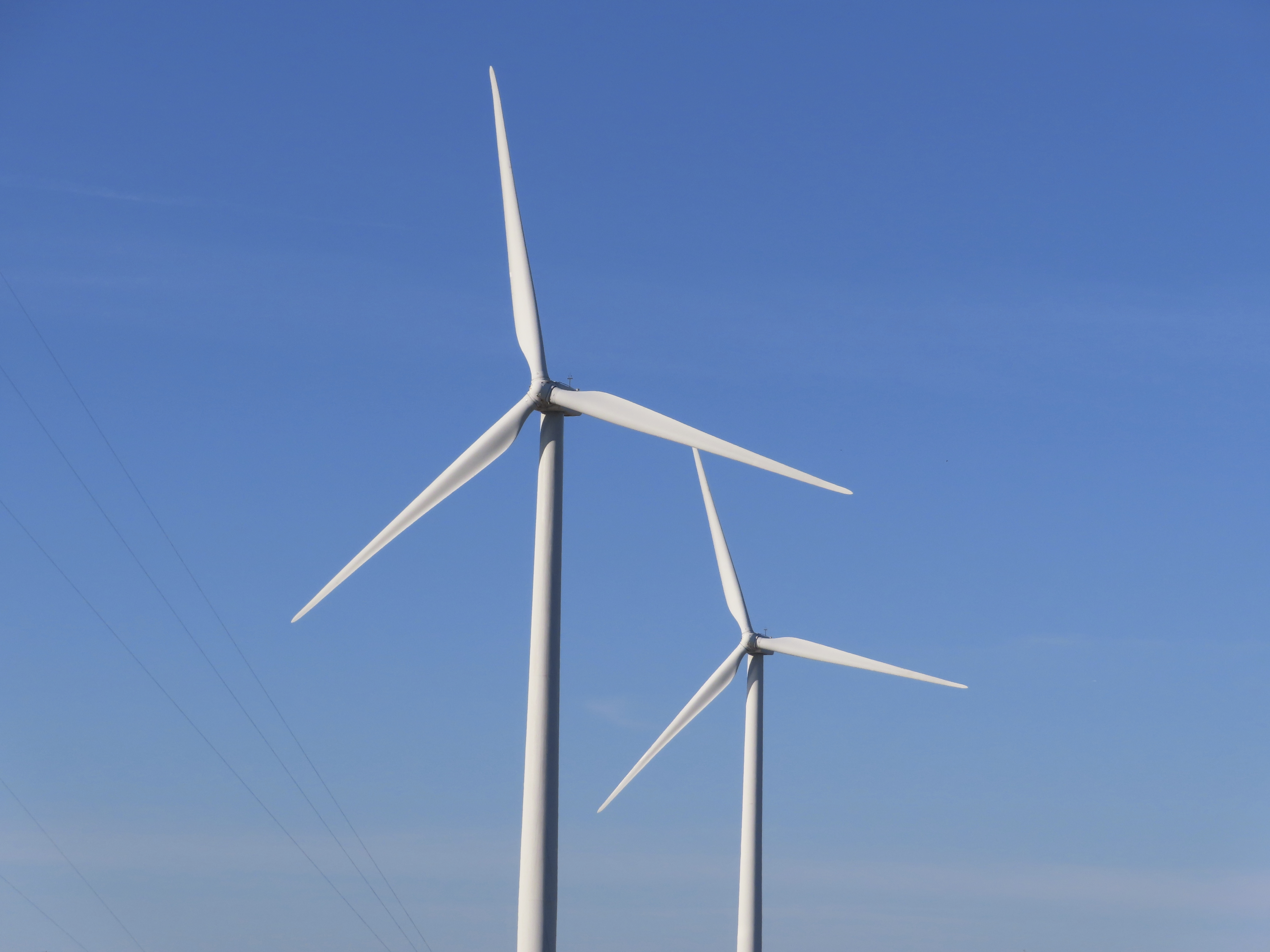 Land-based wind turbines spin in Atlantic City, N.J., on Nov. 3, 2023. (AP Photo/Wayne Parry)