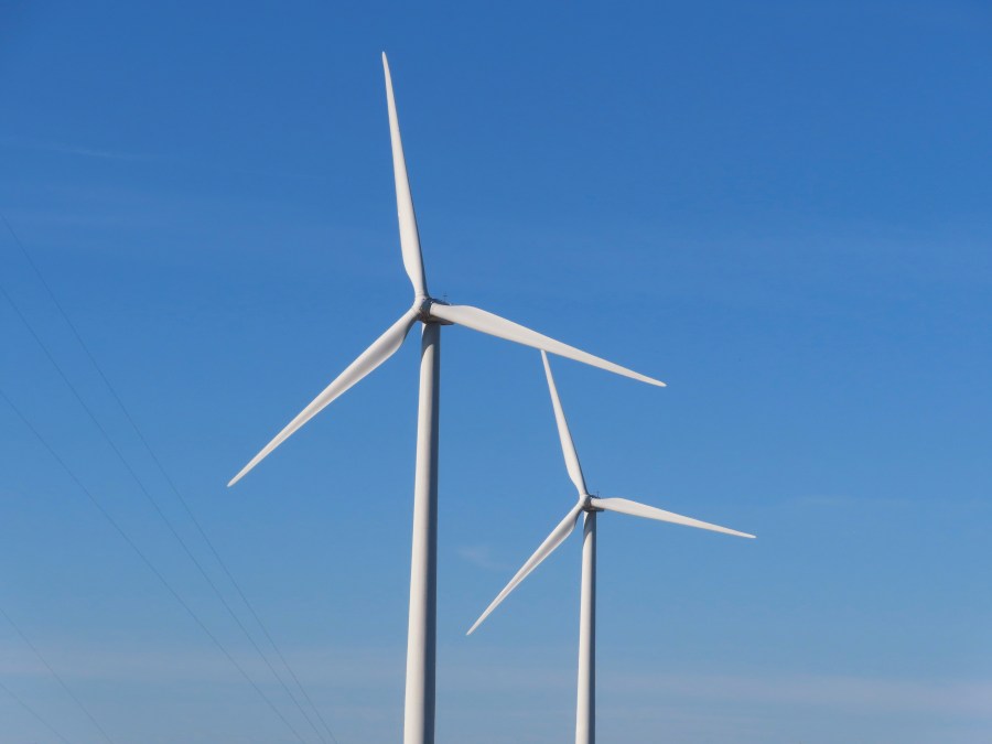 Land-based wind turbines spin in Atlantic City, N.J., on Nov. 3, 2023. (AP Photo/Wayne Parry)