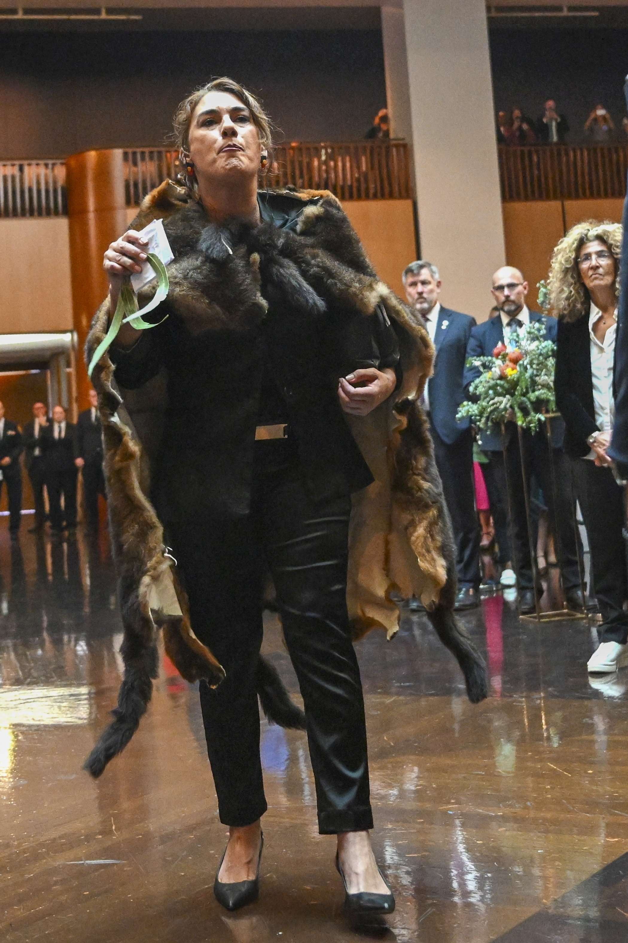 Australian Senator Lidia Thorpe disrupts proceedings as Britain's King Charles and Queen Camilla attend a Parliamentary reception hosted by Australian Prime Minister Anthony Albanese and partner Jodie Jaydon at Parliament House in Canberra, Australia, Monday, Oct. 21, 2024. (Lukas Coch/Pool Photo via AP)