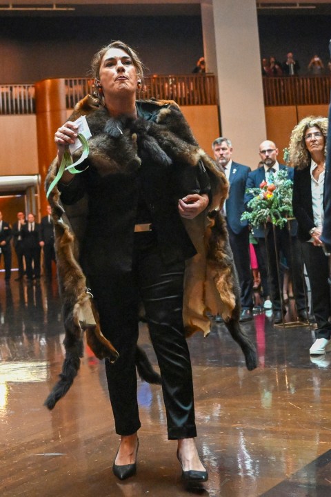 Australian Senator Lidia Thorpe disrupts proceedings as Britain's King Charles and Queen Camilla attend a Parliamentary reception hosted by Australian Prime Minister Anthony Albanese and partner Jodie Jaydon at Parliament House in Canberra, Australia, Monday, Oct. 21, 2024. (Lukas Coch/Pool Photo via AP)