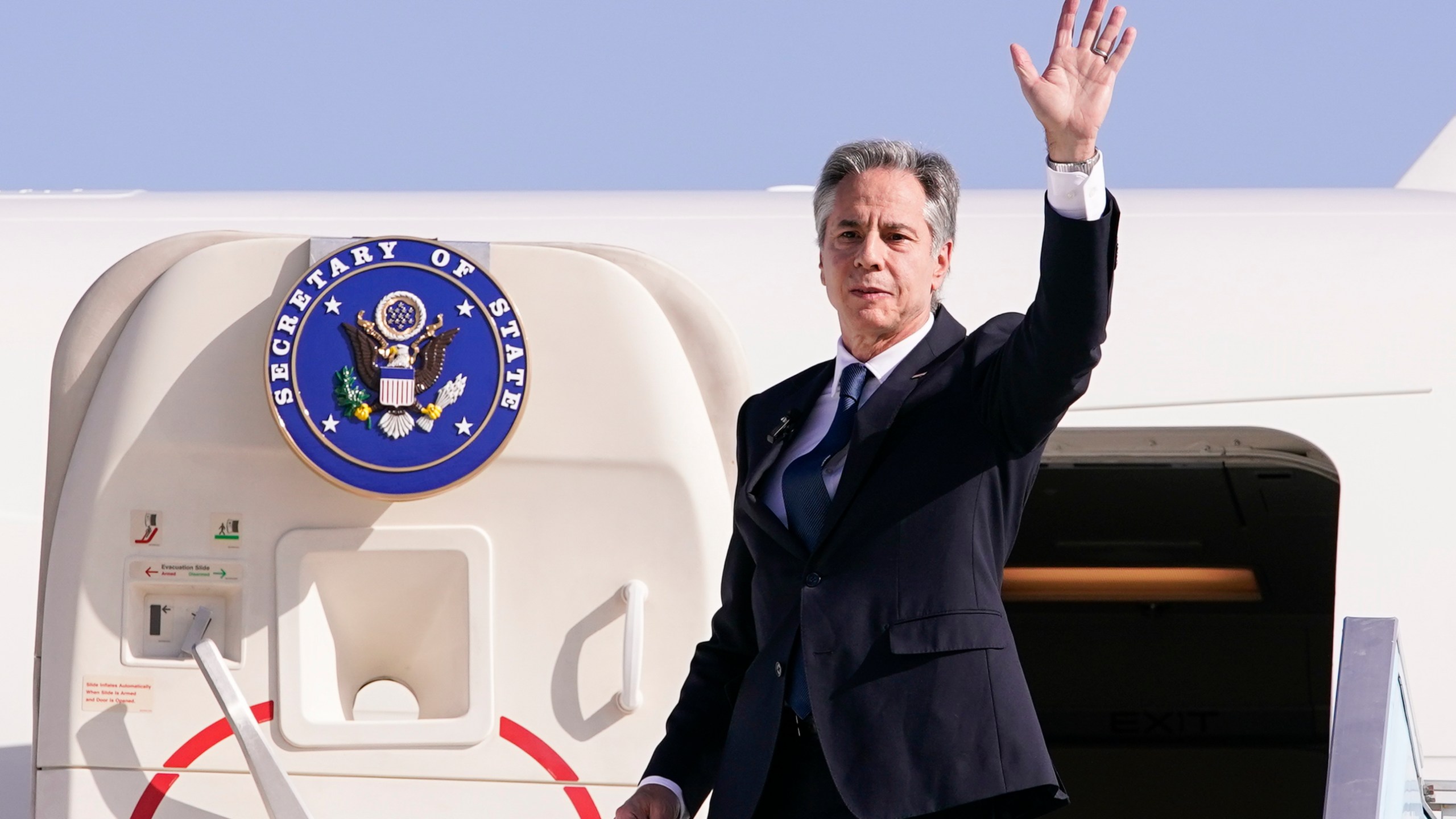 U.S. Secretary of State Antony Blinken waves as he departs for Riyadh, Saudi Arabia, from Ben Gurion International Airport in Tel Aviv, Israel, Wednesday, Oct. 23, 2024. (Nathan Howard/Pool Photo via AP)