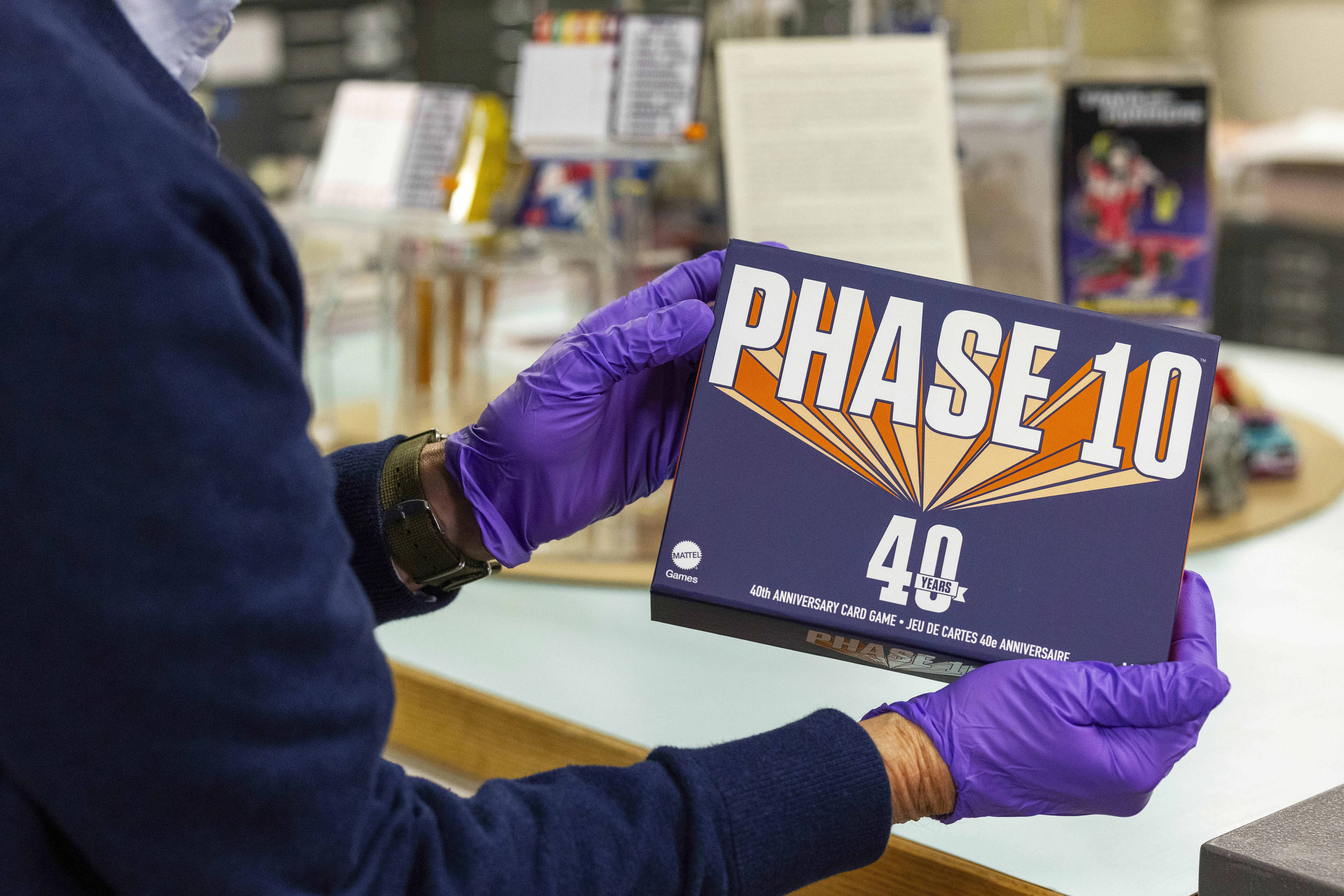 Christopher Bensch, chief curator at The Strong National Museum of Play, holds one of the games that is a finalist for the 2024 Toy Hall of Fame, Tuesday, Oct. 15, 2024, in Rochester, N.Y. (AP Photo/Lauren Petracca)