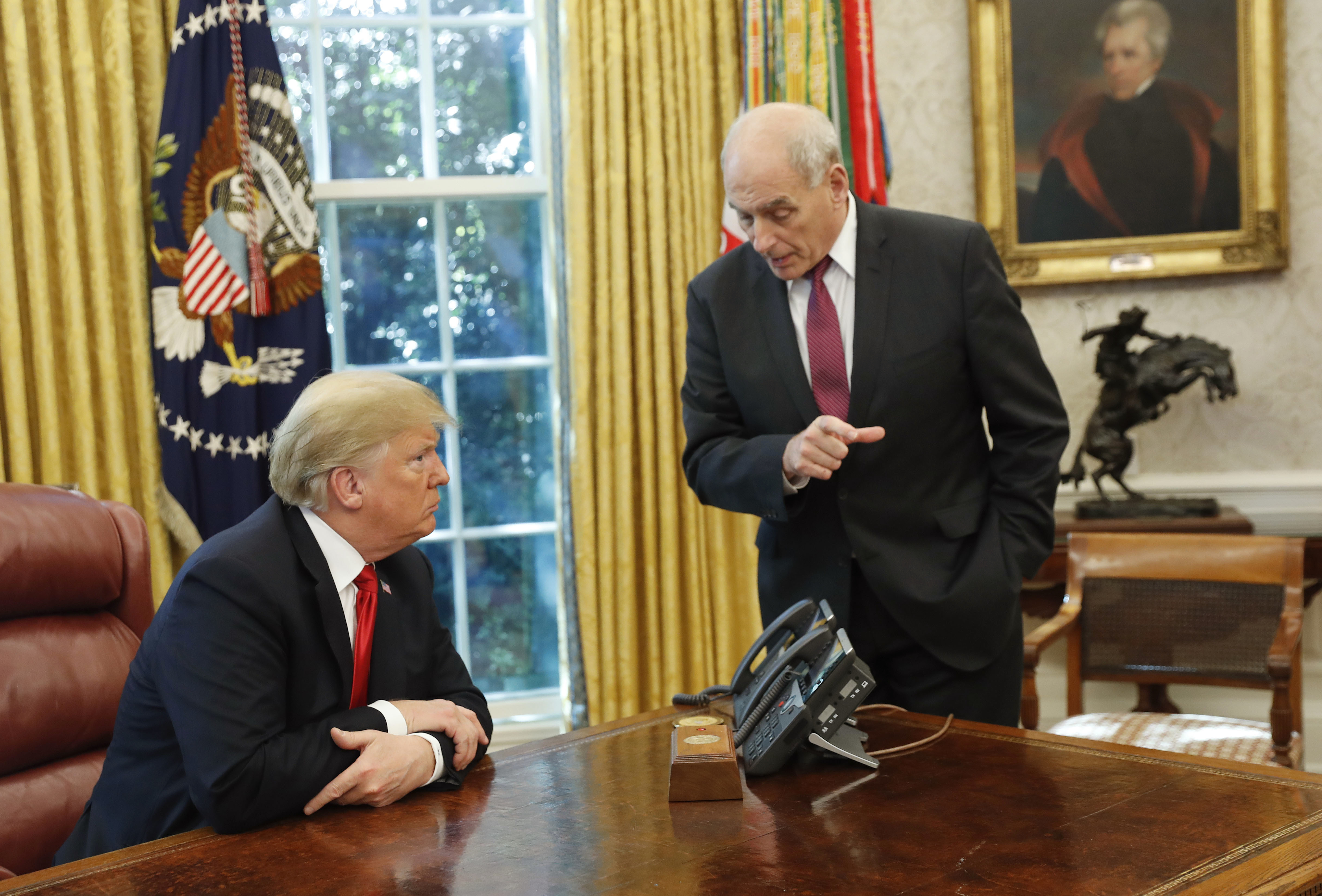 FILE - President Donald Trump listens to White House Chief of Staff John Kelly, right, in the Oval Office of the White House in Washington, Oct. 10, 2018. (AP Photo/Pablo Martinez Monsivais, File)