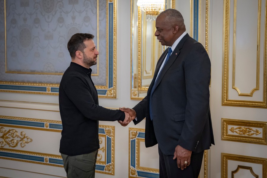 In this photo provided by the Press Service Of The President Of Ukraine on Oct. 21, 2024, U.S. Secretary of Defense Lloyd Austin, right, and Ukraine's President Volodymyr Zelenskyy shake hands during their meeting in Kyiv, Ukraine. (Press Service Of The President Of Ukraine via AP)