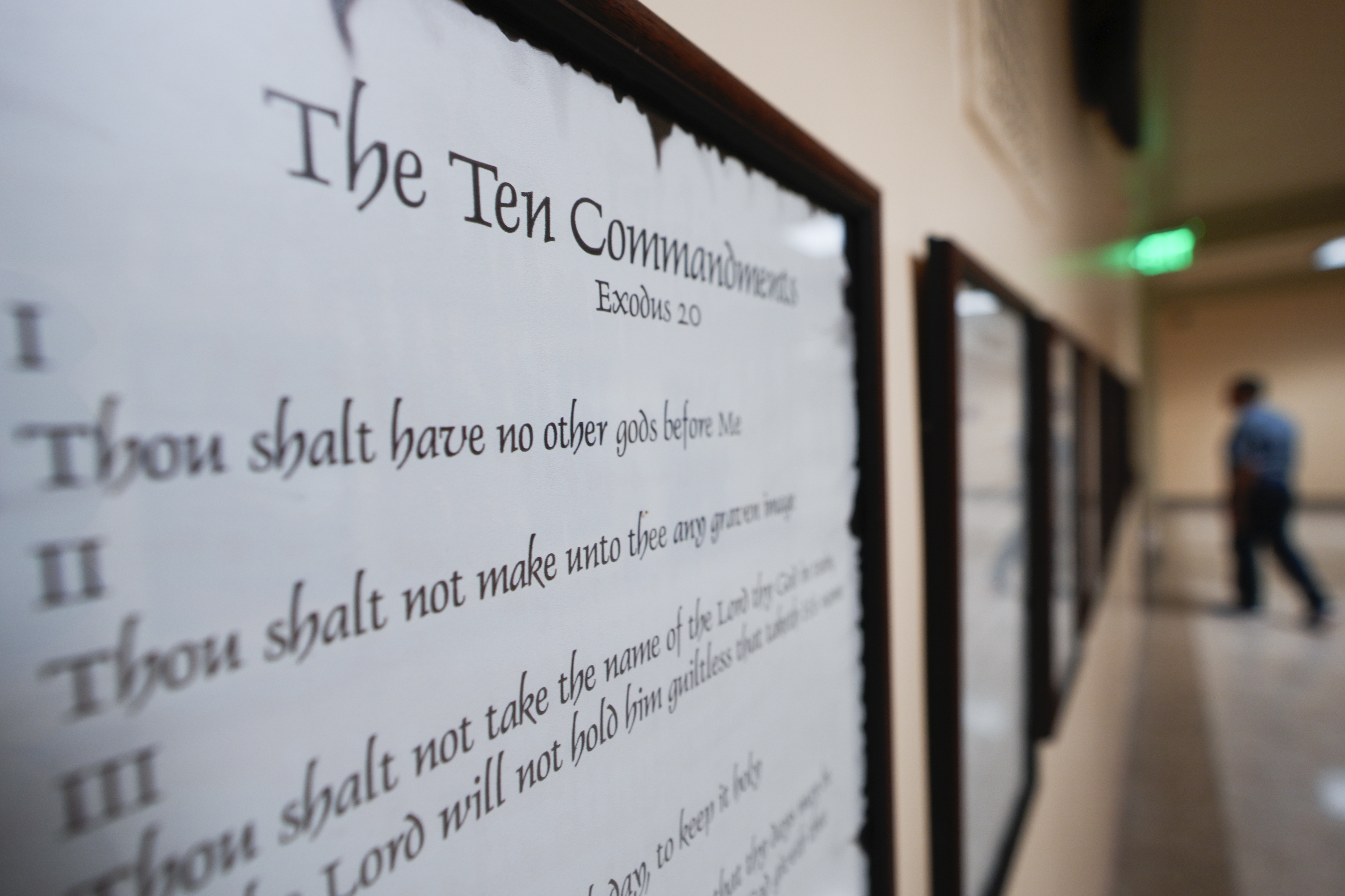 FILE - A copy of the Ten Commandments is posted along with other historical documents in a hallway of the Georgia Capitol, June 20, 2024, in Atlanta. (AP Photo/John Bazemore, File)