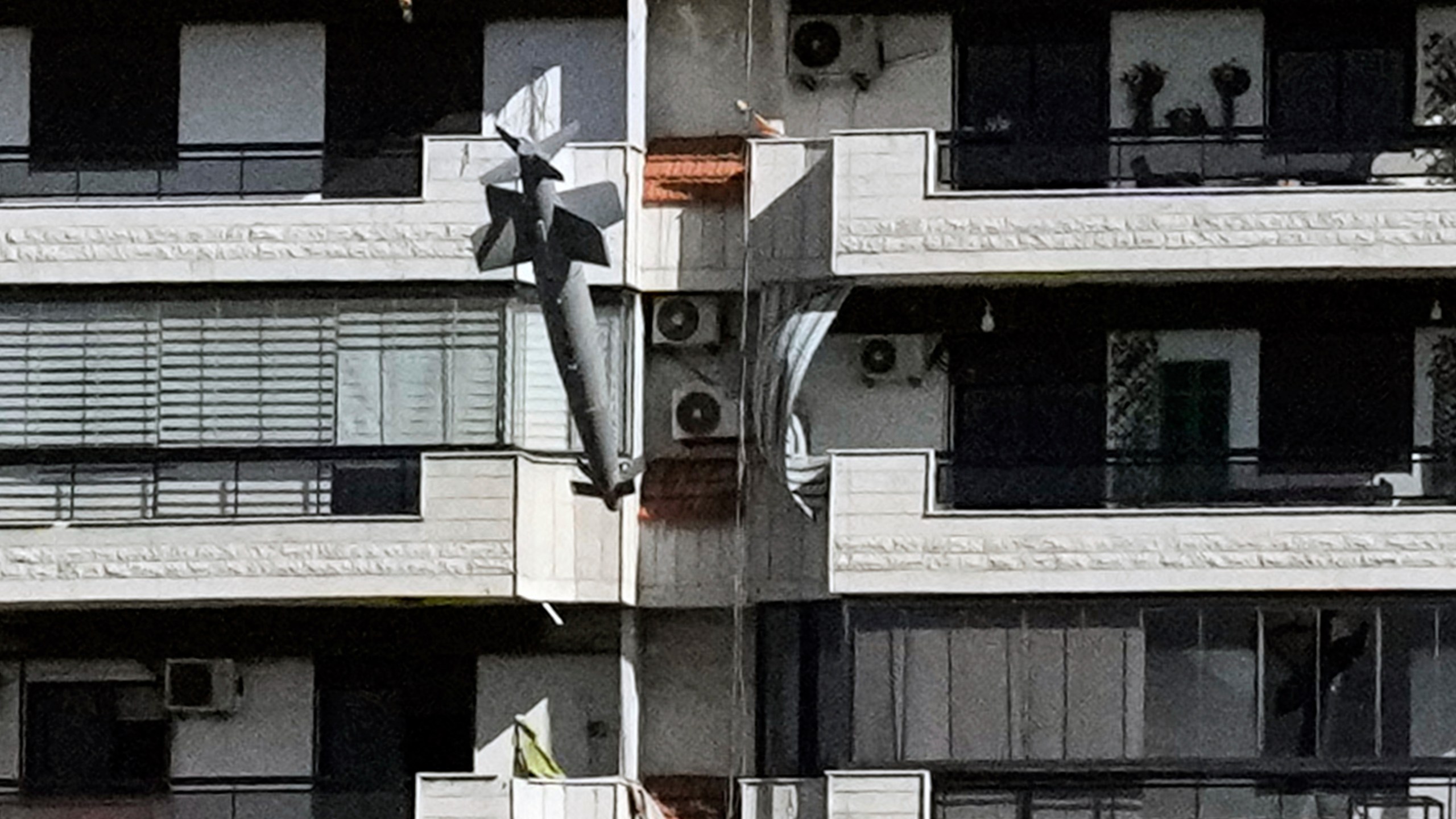 A bomb dropped from an Israeli jet hits a building in Ghobeiri, Beirut, Lebanon, Tuesday, Oct. 22, 2024. (AP Photo/Bilal Hussein)