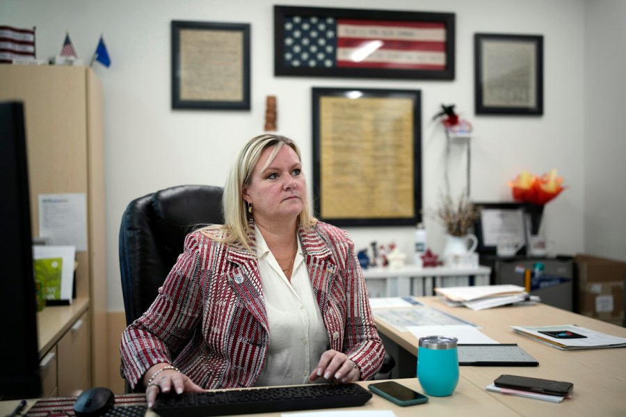 Cari-Ann Burgess, interim Registrar of Voters for Washoe County, Nev., sits in her office Sept. 20, 2024, in Reno, Nev. (AP Photo/John Locher)