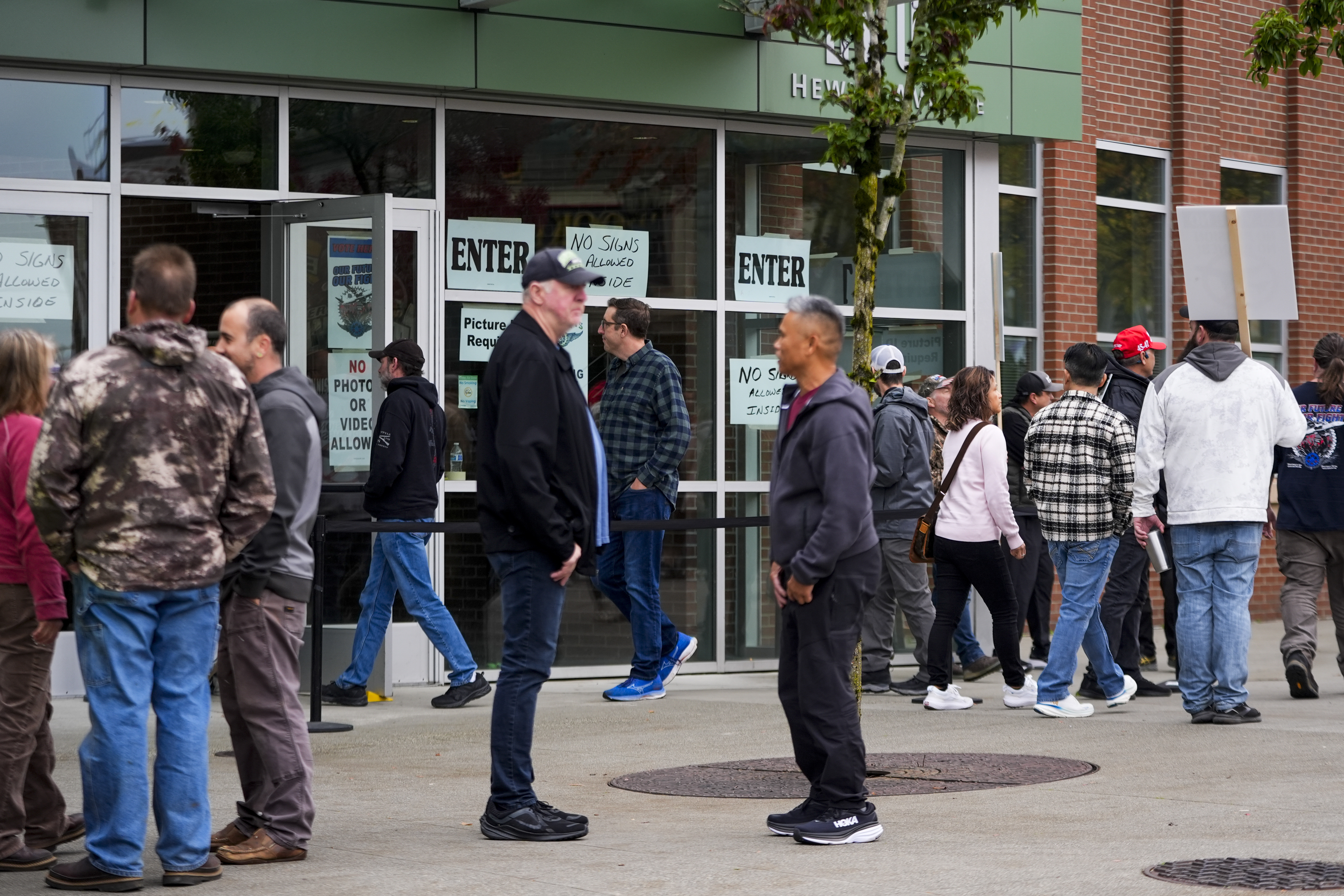 Boeing employees on strike arrive to vote on a new contract offer from the company, Wednesday, Oct. 23, 2024, at a voting location in the Angel of the Winds Arena in Everett, Wash. (AP Photo/Lindsey Wasson)