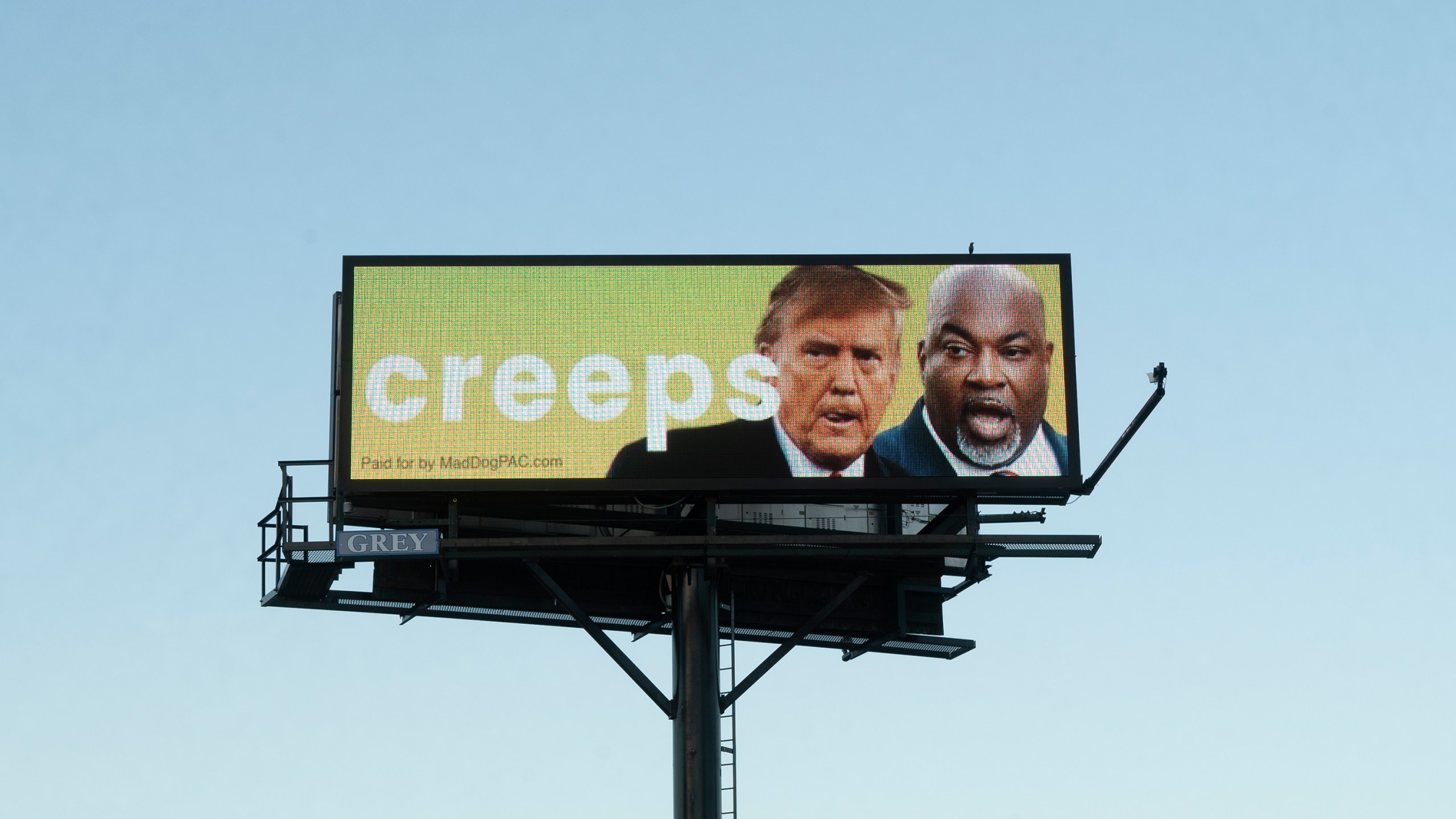 A billboard linking former President Donald Trump and Republican gubernatorial nominee Mark Robinson looms U.S. 1 in Youngsville, N.C., on Monday, Oct. 14, 2024. Trump has boasted that his U.S. Supreme Court nominees overturned the nationwide right to abortion, and Robinson's controversial statements on abortion have been a focus of Democrats in the state. (AP Photo/Allen G. Breed)