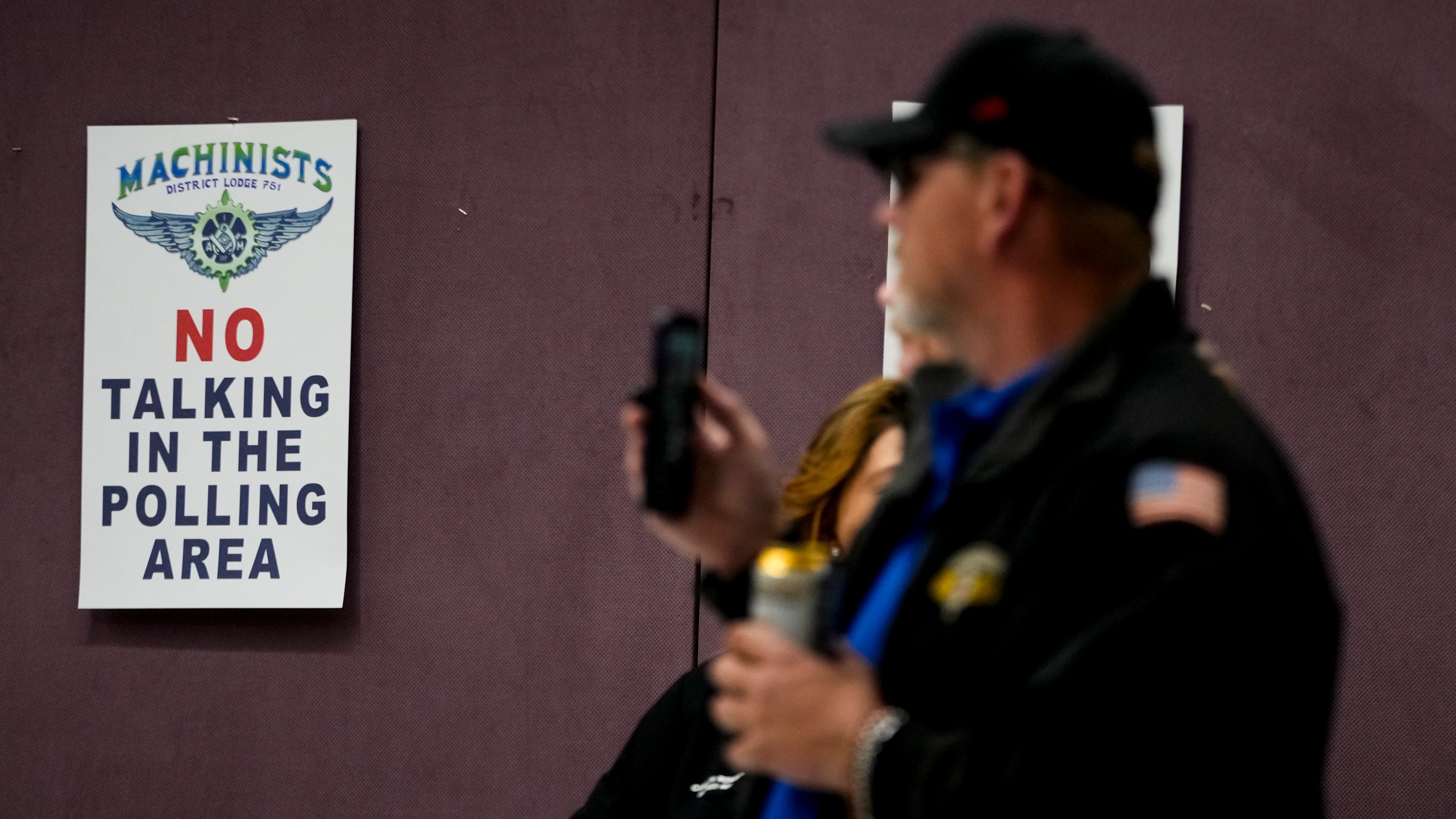 Union members watch as volunteers tally votes on a new contract offer from Boeing, Wednesday, Oct. 23, 2024, at Seattle Union Hall in Seattle. (AP Photo/Lindsey Wasson)