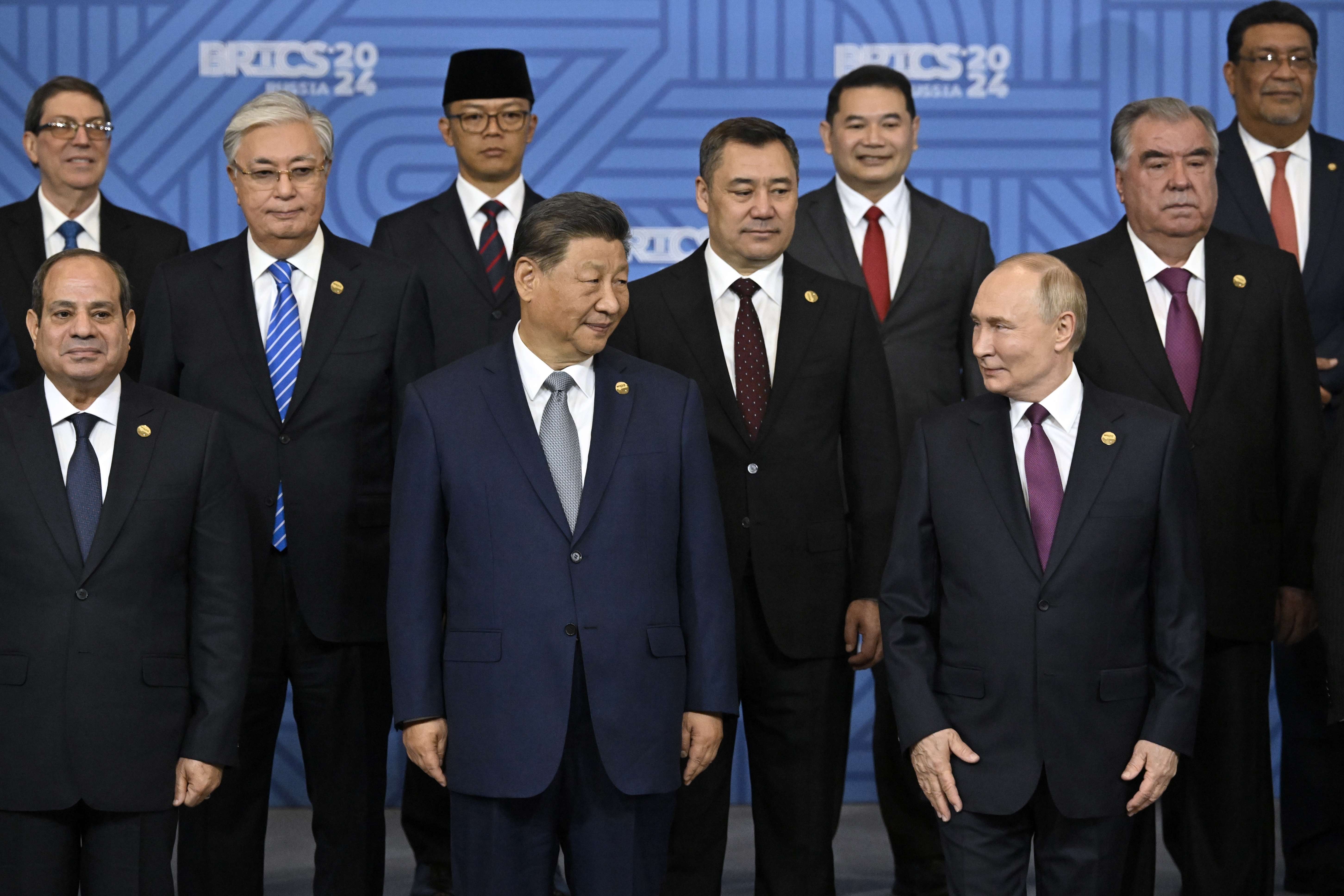 Russian President Vladimir Putin, right, and other participants pose for a family photo prior to Outreach/BRICS Plus format session at BRICS Summit in Kazan, Russia, Thursday, Oct. 24, 2024. (Alexander Nemenov, Pool Photo via AP)