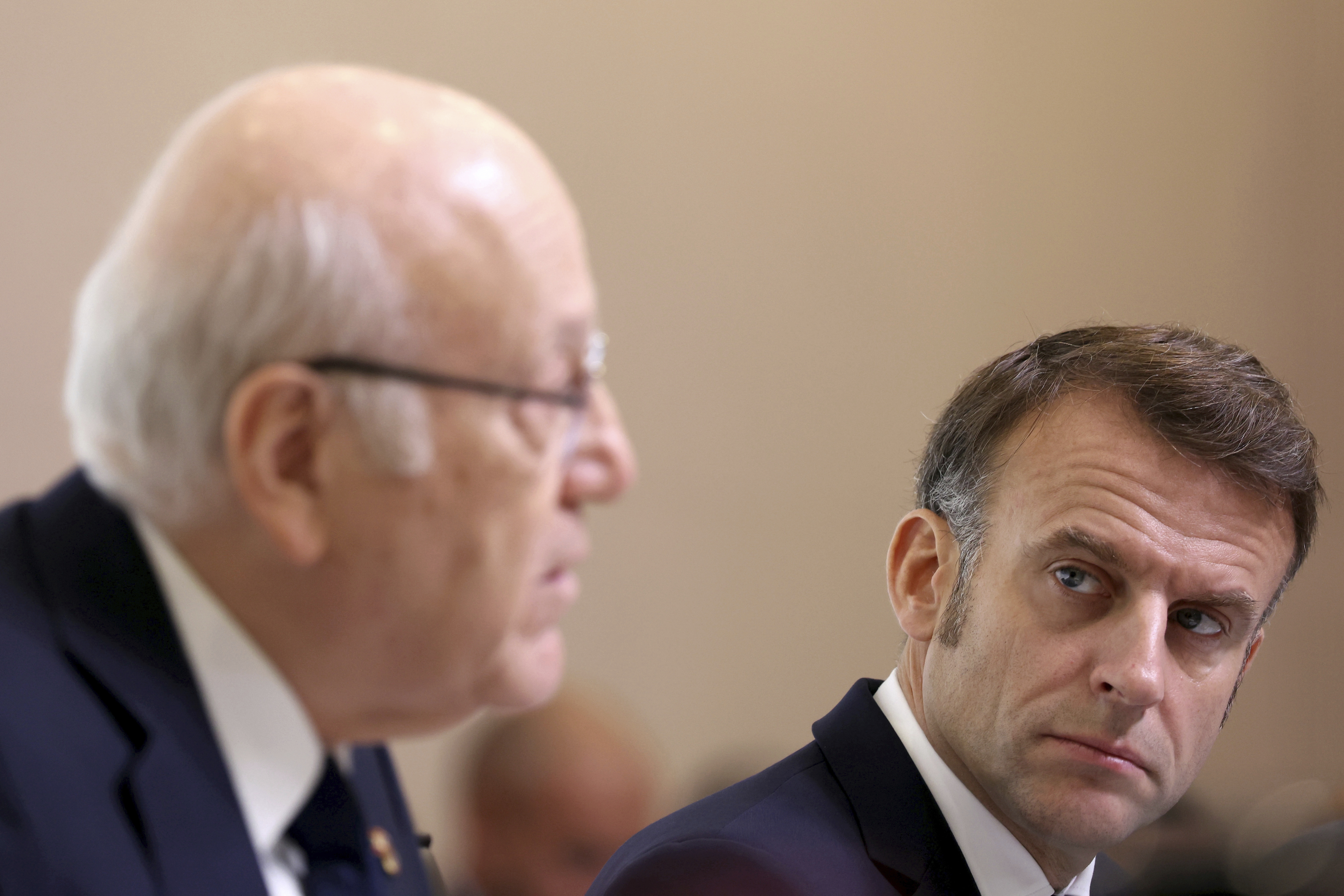 French President Emmanuel Macron listens to Lebanon's Prime Minister caretaker Prime Minister Najib Mikati, left, during international conference for Lebanon in Paris, Thursday, Oct.24, 2024. (Alain Jocard, Pool via AP)