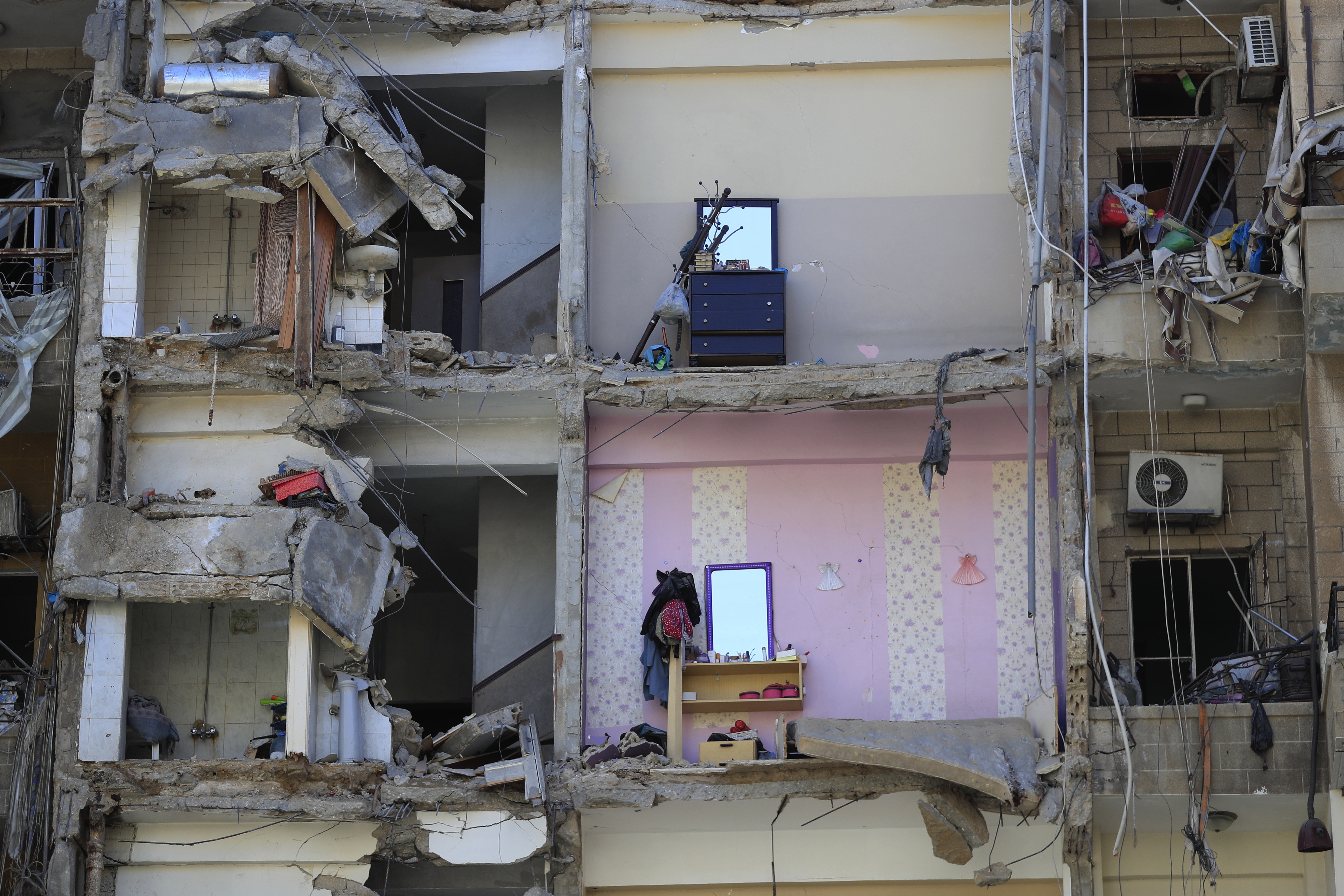 Damaged furnitures left on destroyed apartments that were hit by Israeli airstrikes, in Tyre, south Lebanon, Thursday, Oct. 24, 2024. (AP Photo/Mohammed Zaatari)