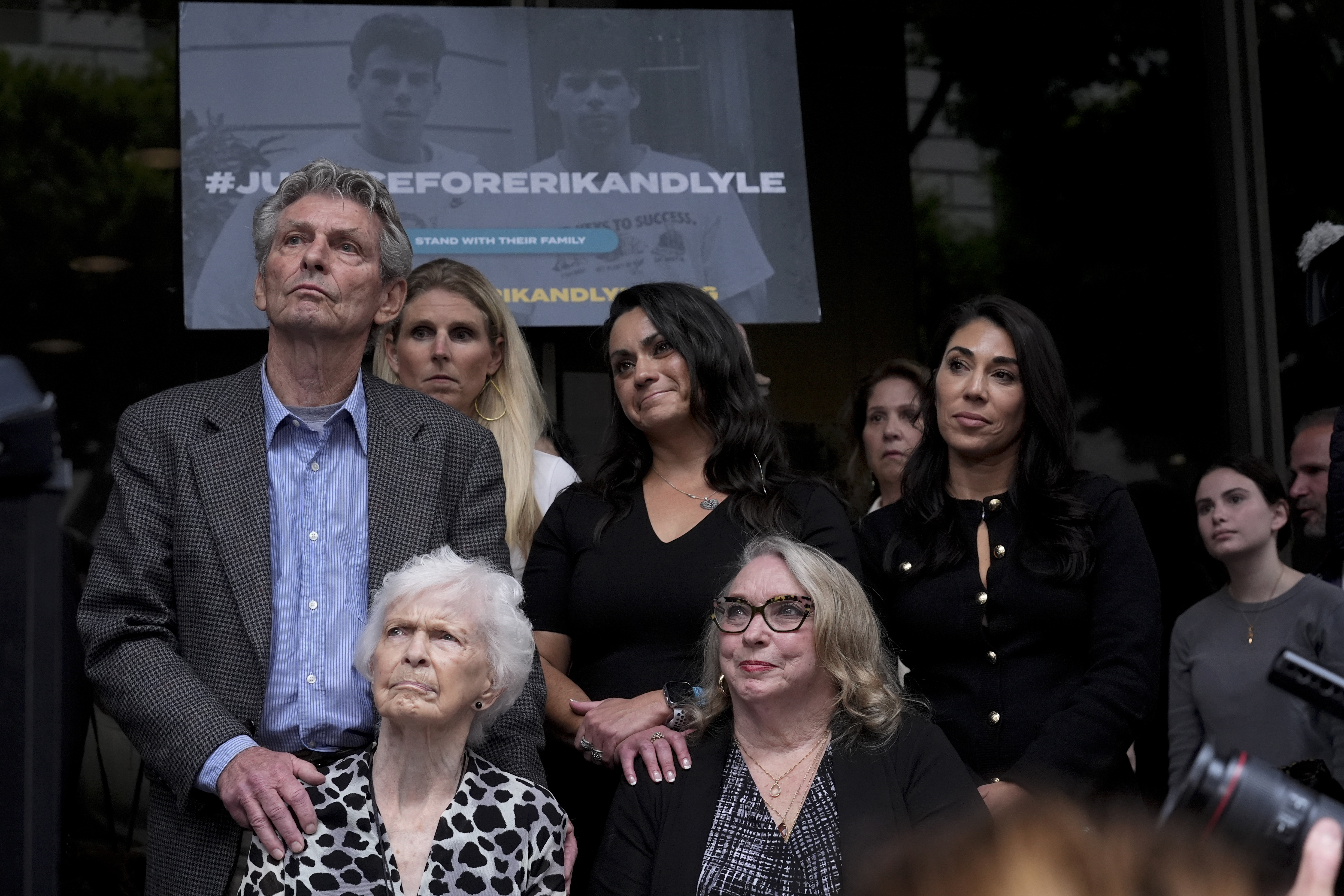 FILE - Kitty Menendez's sister, Joan Andersen VanderMolen, bottom left, and niece Karen VanderMolen, right, sit together during a press conference to announce developments on the case of brothers Erik and Lyle Menendez, Wednesday, Oct. 16, 2024, in Los Angeles. (AP Photo/Damian Dovarganes, File)