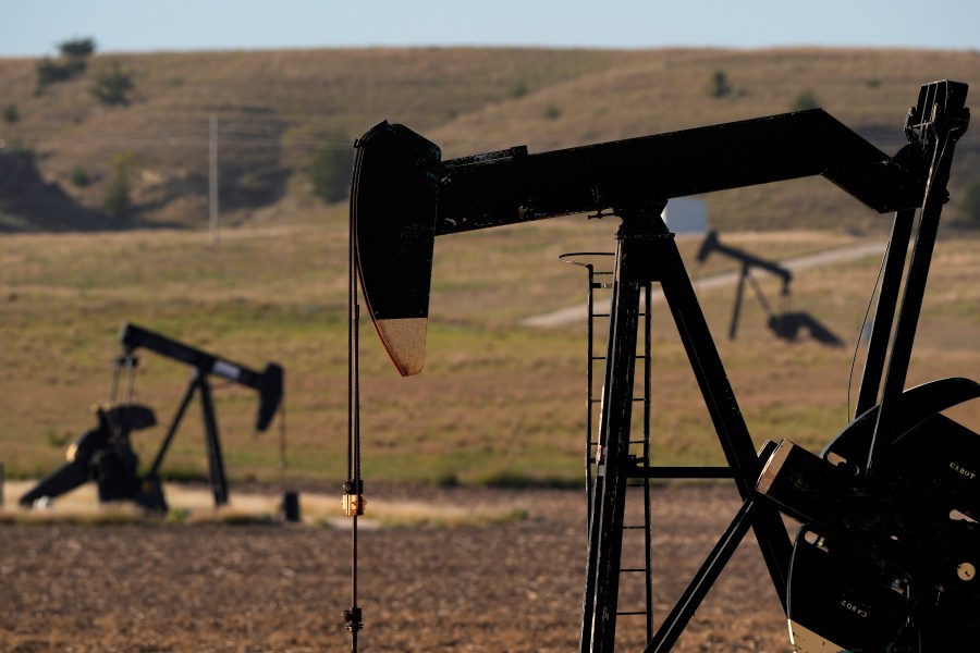 Pumpjacks operate in a pasture, Monday, Sept. 30, 2024, near Hays, Kan. (AP Photo/Charlie Riedel)