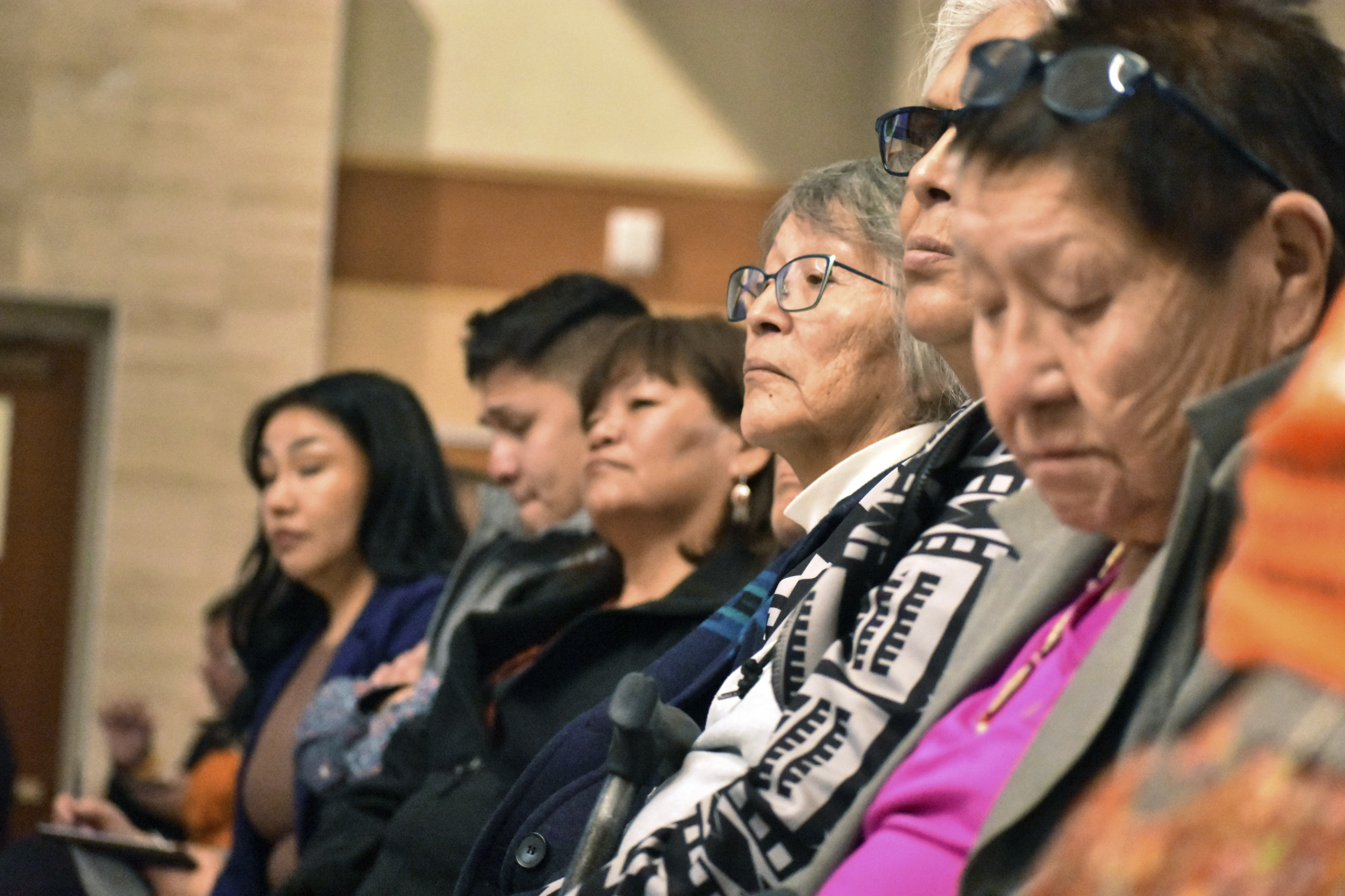 FILE - Elders from the Northern Cheyenne Tribe in southeastern Montana listen to speakers during a session for survivors of government-sponsored Native American boarding schools, in Bozeman, Mont., Nov. 5, 2023. (AP Photo/Matthew Brown, File)