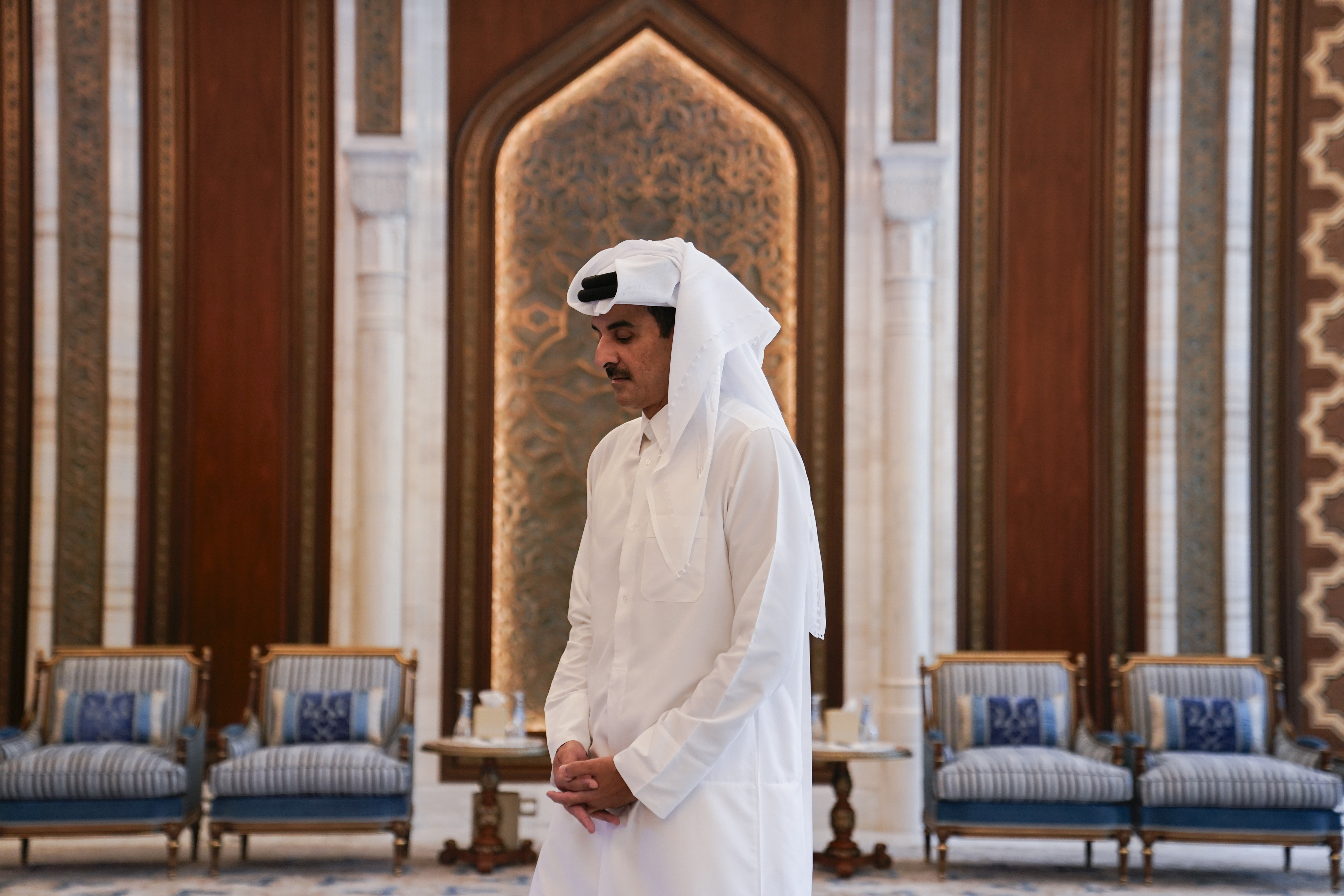 Qatar's Emir Sheikh Tamim bin Hamad al-Thani waits to receive U.S. Secretary of State Antony Blinken, in Doha, Qatar, Thursday, Oct. 24, 2024. (Nathan Howard/Pool Photo via AP)