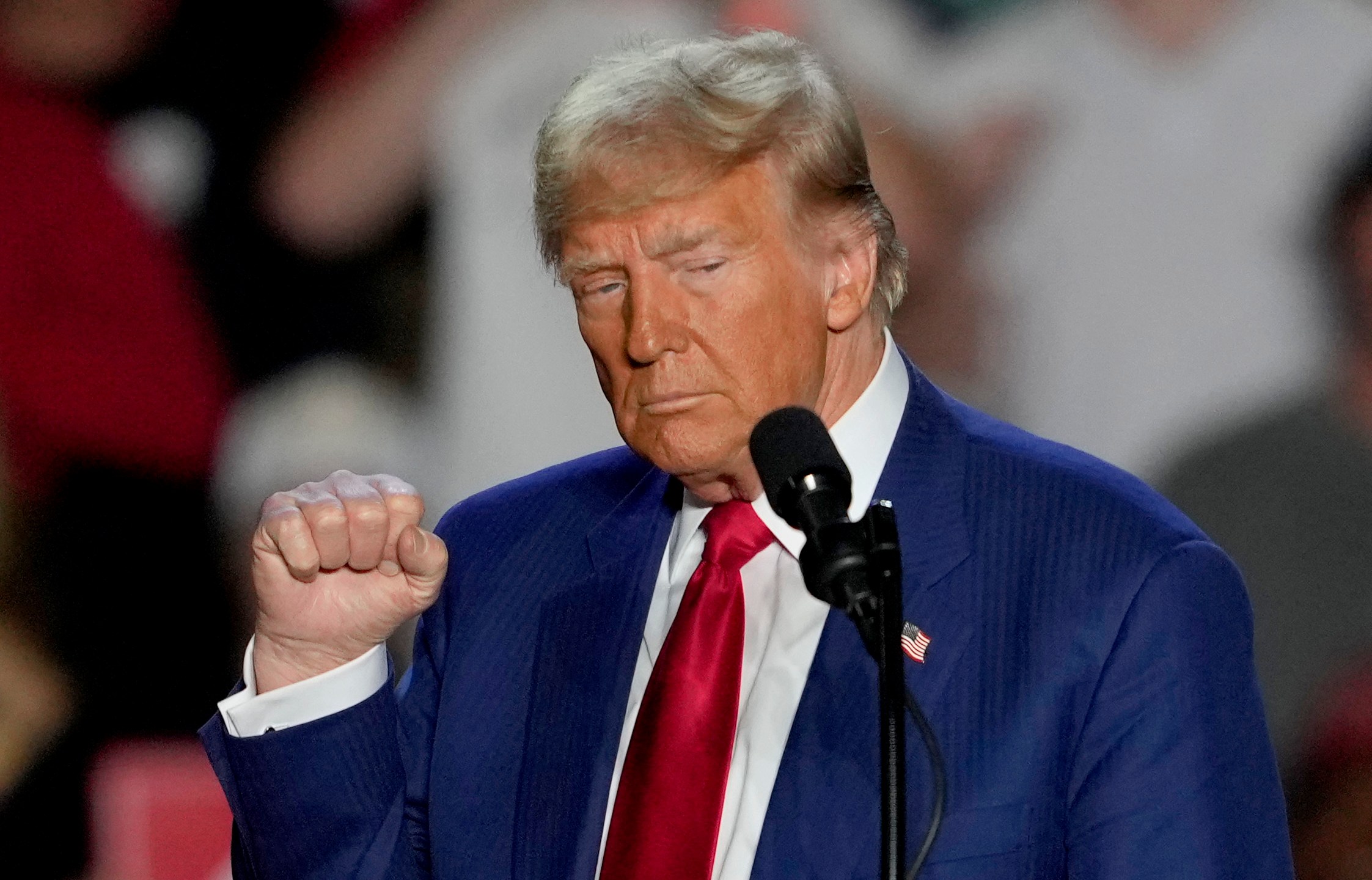 Republican presidential nominee former President Donald Trump gestures as he speaks at a campaign event at Mullett Arena, Thursday, Oct. 24, 2024, in Tempe, Ariz. (AP Photo/Matt York)