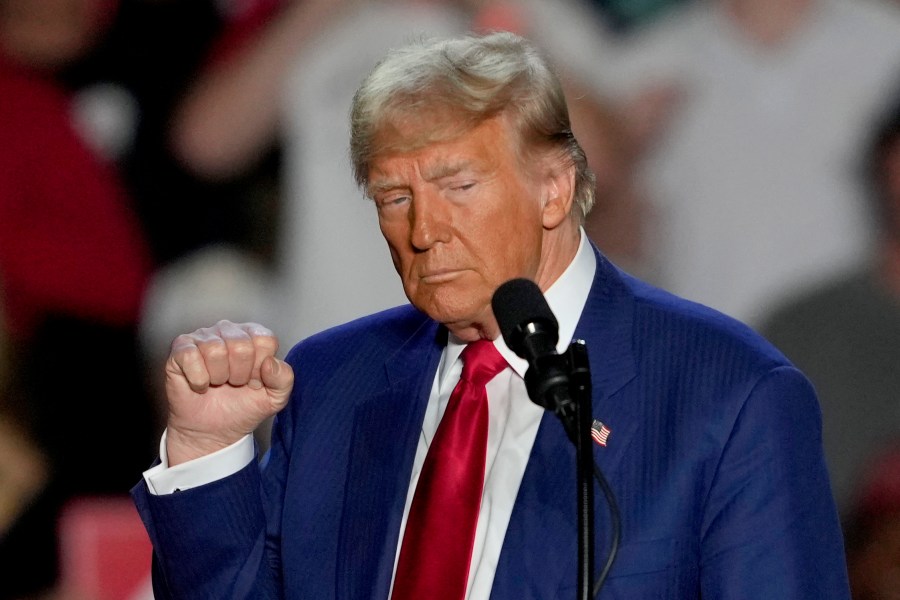 Republican presidential nominee former President Donald Trump gestures as he speaks at a campaign event at Mullett Arena, Thursday, Oct. 24, 2024, in Tempe, Ariz. (AP Photo/Matt York)