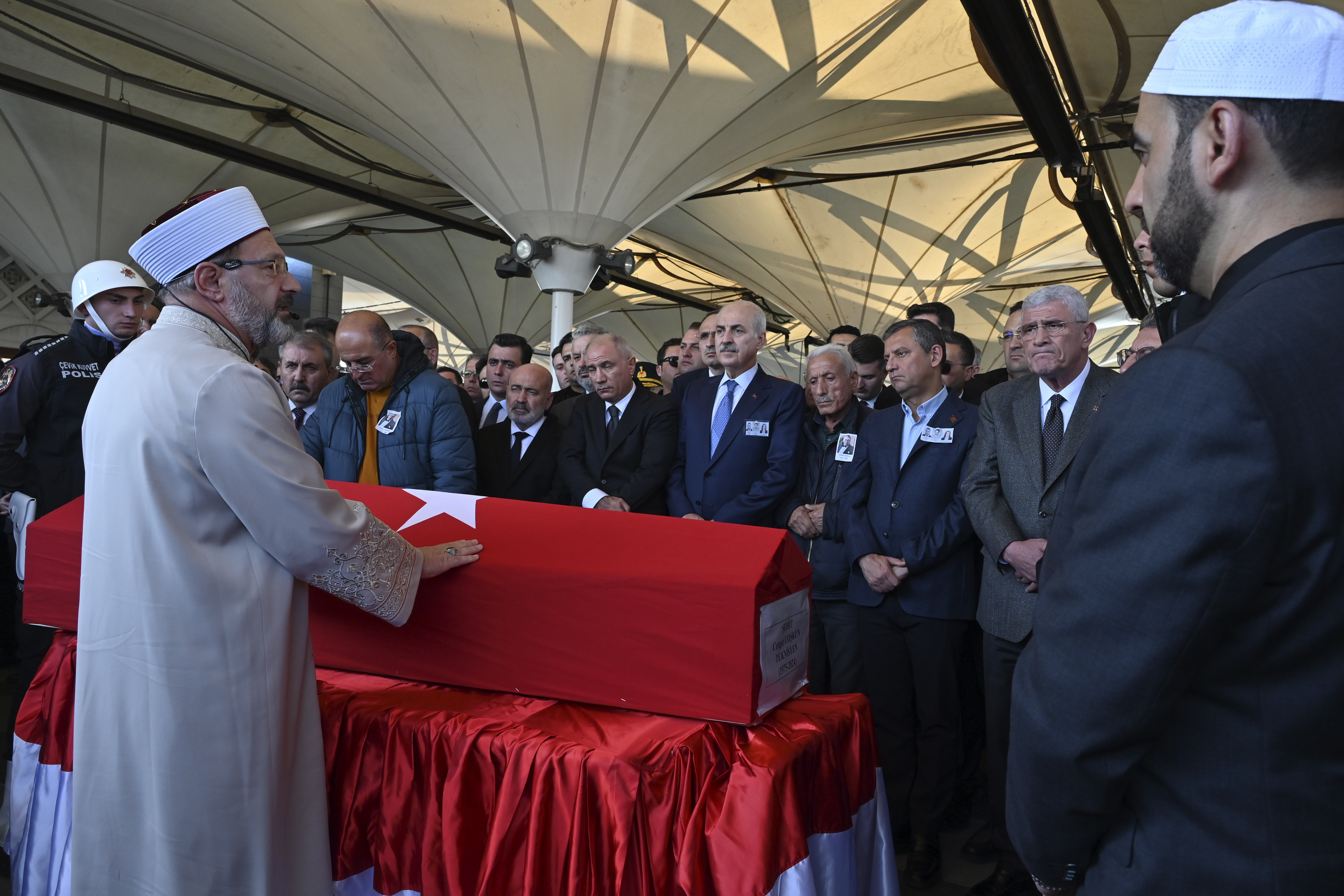 Relatives and authorities pray next to the coffin of Cengiz Coskun, who was killed during an attack by PKK members at the Turkish aerospace and defense company TUSAS on Wednesday, during a funeral at Karsiyaka mosque in Ankara, Thursday, Oct. 24, 2024. (AP Photo/Ali Unal)