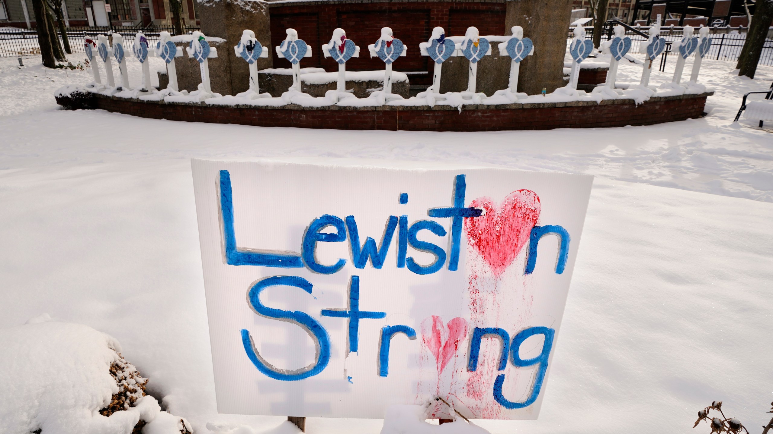 FILE - Snow coats crosses at one of several memorials for the victims of last month's mass shooting in Lewiston, Maine, in this Tuesday, Dec. 5, 2023 file photo. (AP Photo/Robert F. Bukaty, File)