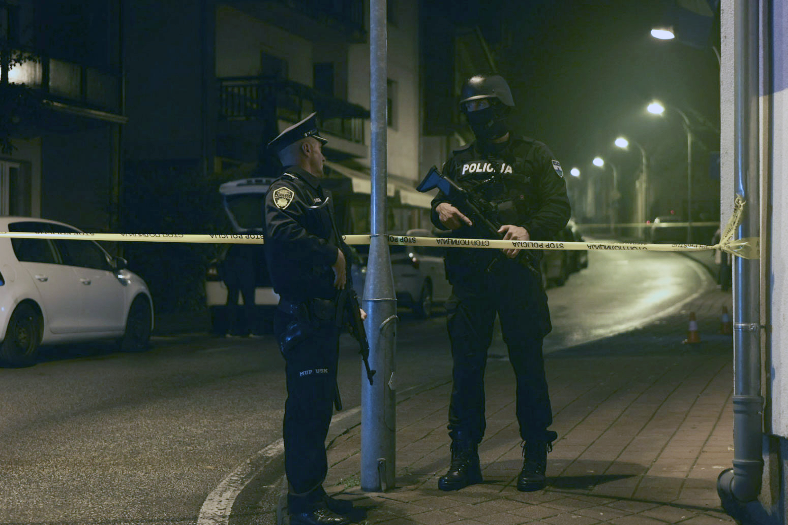 Bosnian police officer guard the local police station after a teenager broke and killed one officer with a knife and wounded another, in the town of Bosanska Krupa, 200 kilometers (120 miles) northwest of Bosnia's capital Sarajevo, Thursday, Oct. 24, 2024. (AP Photo/Edvin Zulic)