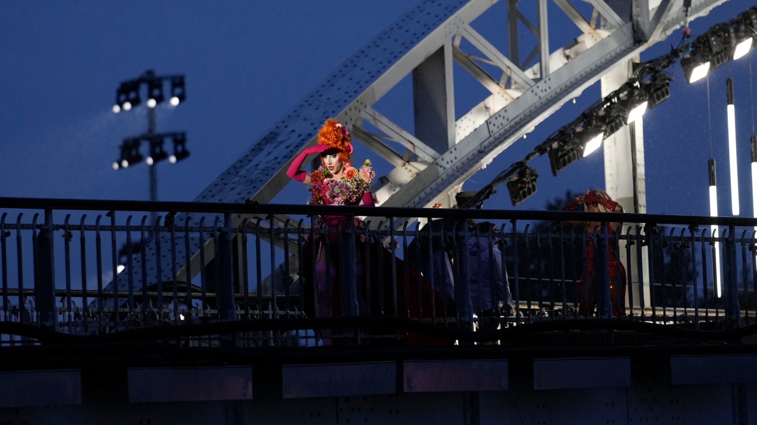 FILE - Drag queens prepare to perform on the Debilly Bridge in Paris, during the opening ceremony of the 2024 Summer Olympics, Friday, July 26, 2024. (AP Photo/Tsvangirayi Mukwazhi, File)