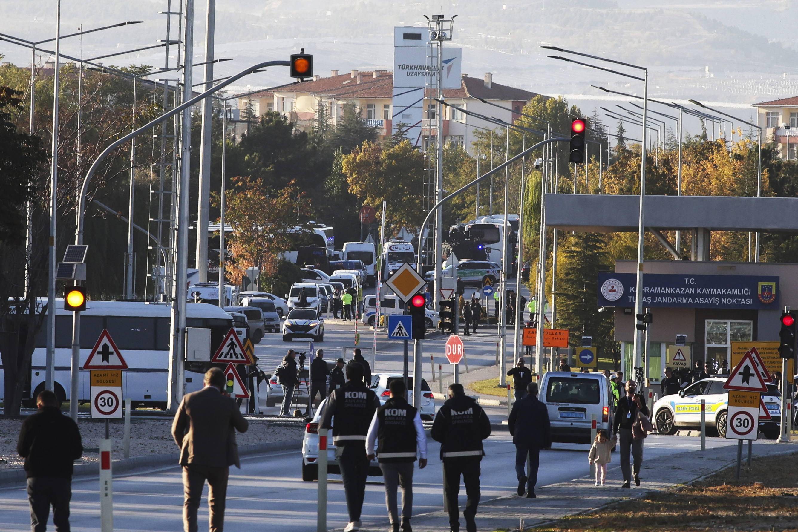 Emergency and security teams are deployed outside of Turkish Aerospace Industries Inc. at the outskirts of Ankara, Turkey, Wednesday, Oct. 23, 2024. (Yavuz Ozden/Dia Photo via AP)