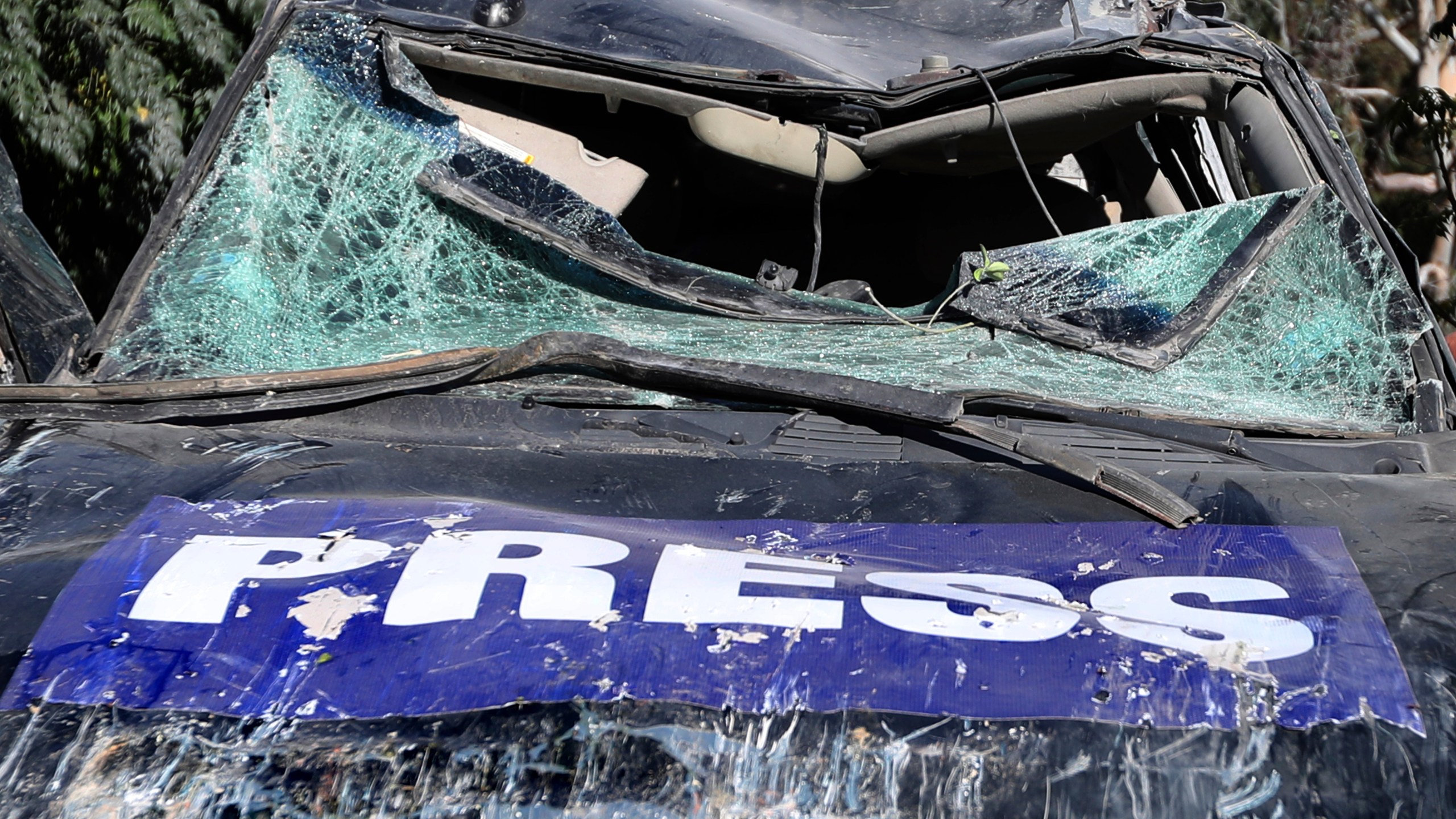 A destroyed journalists car is seen at the site where an Israeli airstrike hit a compound housing journalists, killing three media staffers from two different news agencies according to Lebanon's state-run National News Agency, in Hasbaya village, southeast Lebanon, Friday, Oct. 25, 2024. (AP Photo/Mohammed Zaatari)