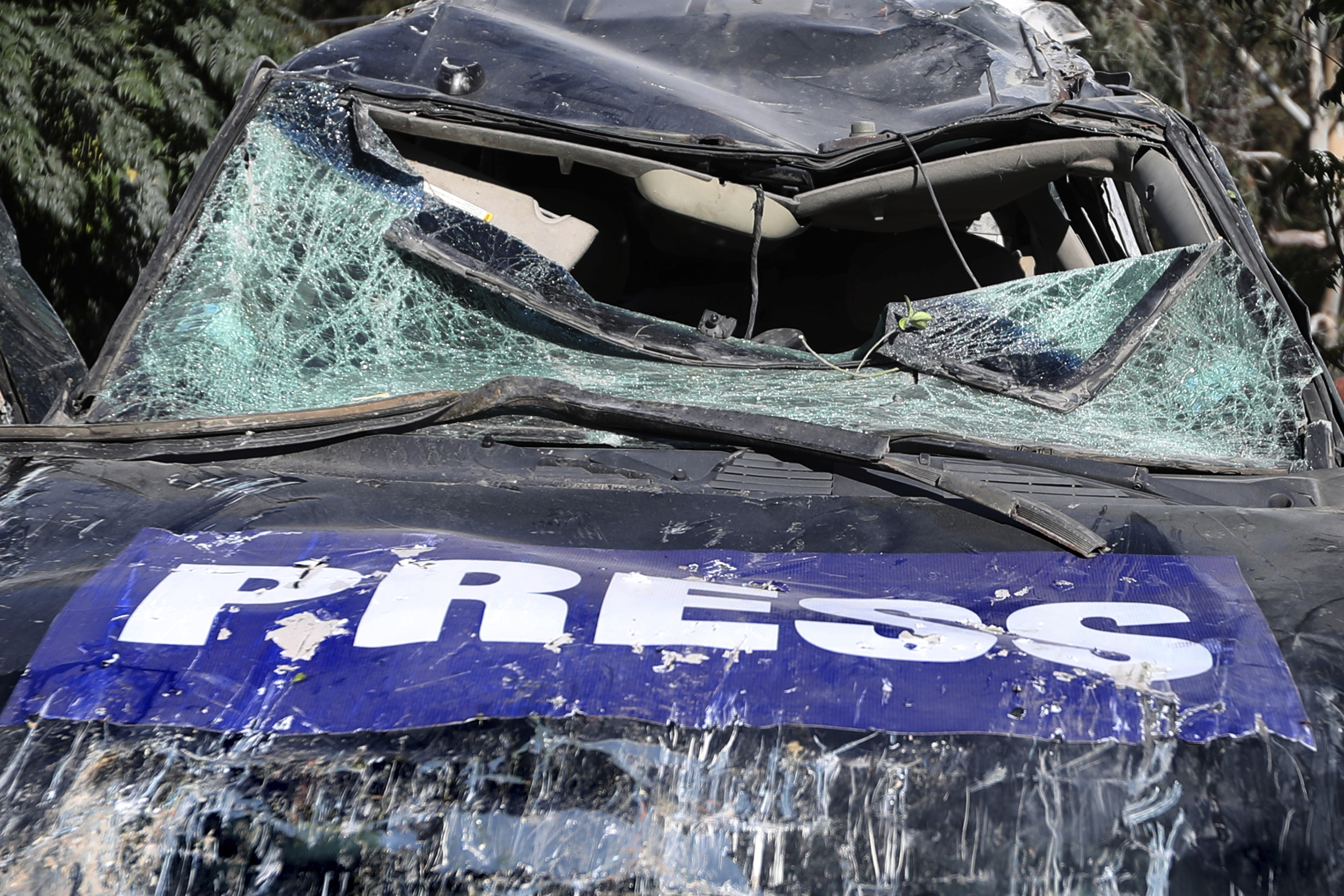 A destroyed journalists car is seen at the site where an Israeli airstrike hit a compound housing journalists, killing three media staffers from two different news agencies according to Lebanon's state-run National News Agency, in Hasbaya village, southeast Lebanon, Friday, Oct. 25, 2024. (AP Photo/Mohammed Zaatari)