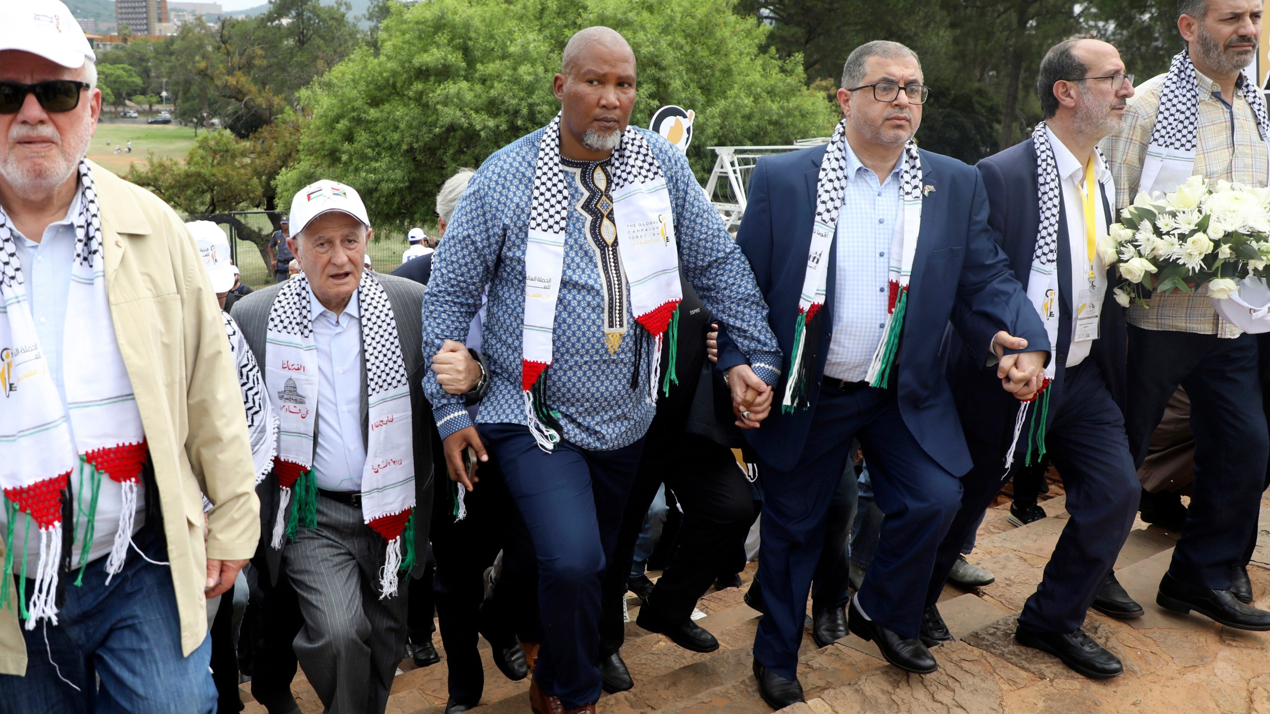 FILE - Nelson Mandela's grandson Mandla Mandela, center, with Hamas official Basem Naim, center right, during a march to commemorate the 10th anniversary of the death of former South African president Nelson Mandela in Pretoria, South Africa, Tuesday, Dec. 5, 2023. (AP Photo, File)