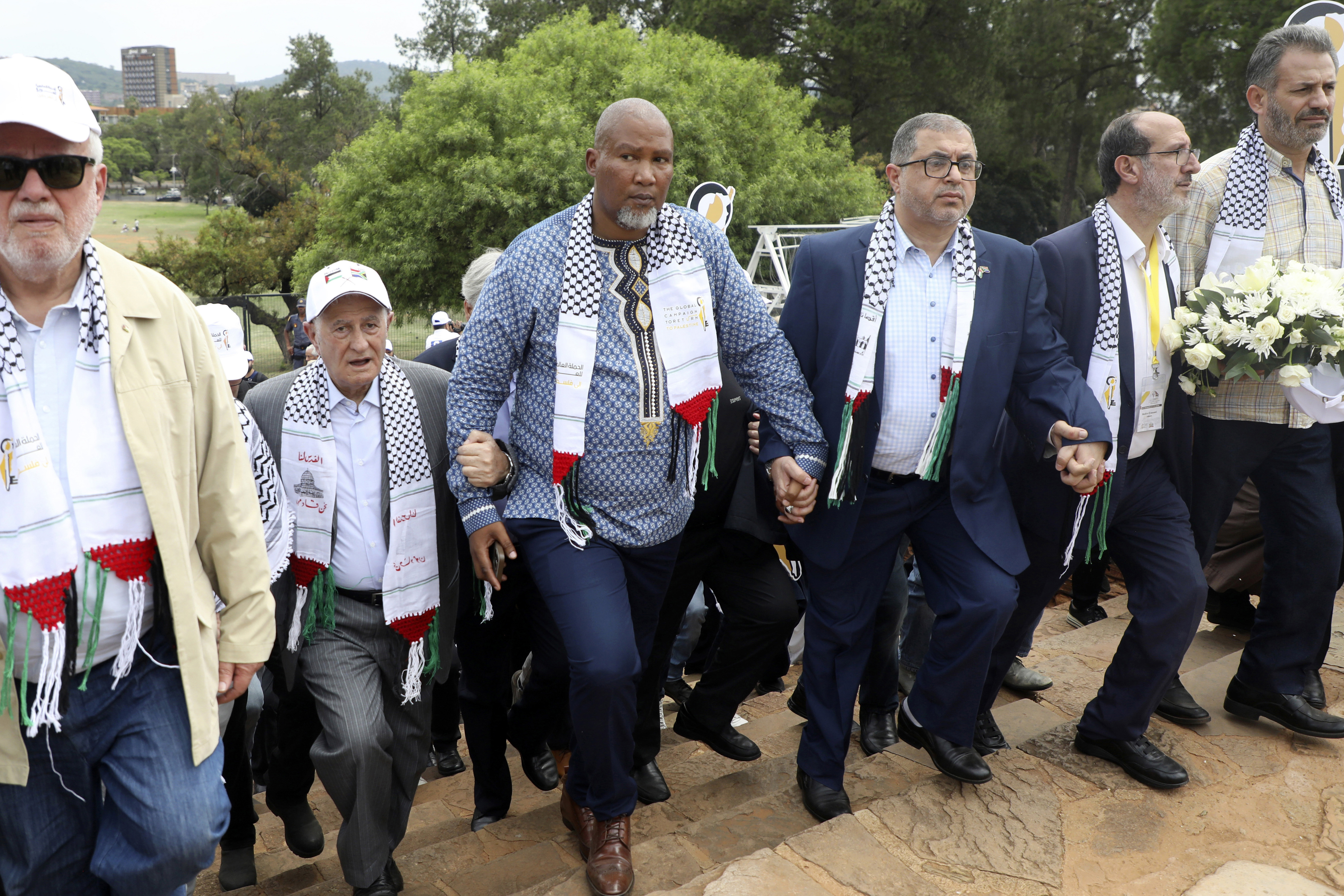 FILE - Nelson Mandela's grandson Mandla Mandela, center, with Hamas official Basem Naim, center right, during a march to commemorate the 10th anniversary of the death of former South African president Nelson Mandela in Pretoria, South Africa, Tuesday, Dec. 5, 2023. (AP Photo, File)