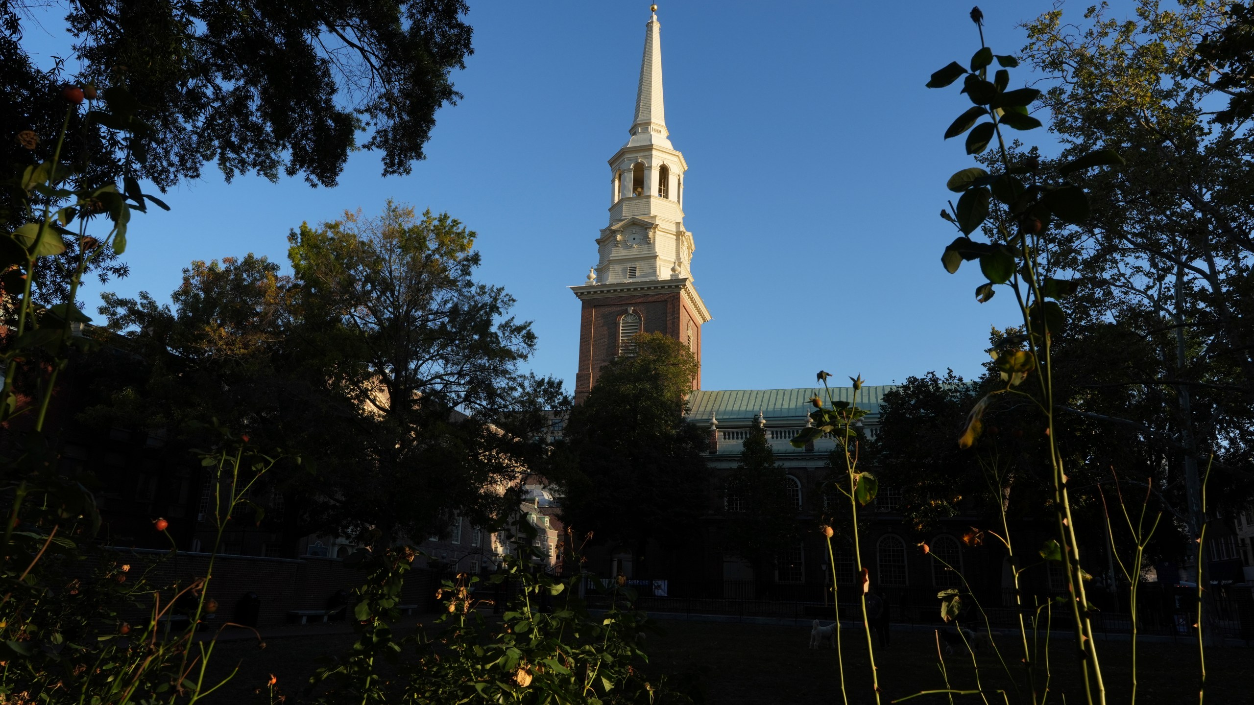 The Christ Church steeple, financed and built through a lottery spearheaded by Benjamin Franklin, rises into the sky in Philadelphia on Sunday, Oct. 6, 2024. (AP Photo/Luis Andres Henao)