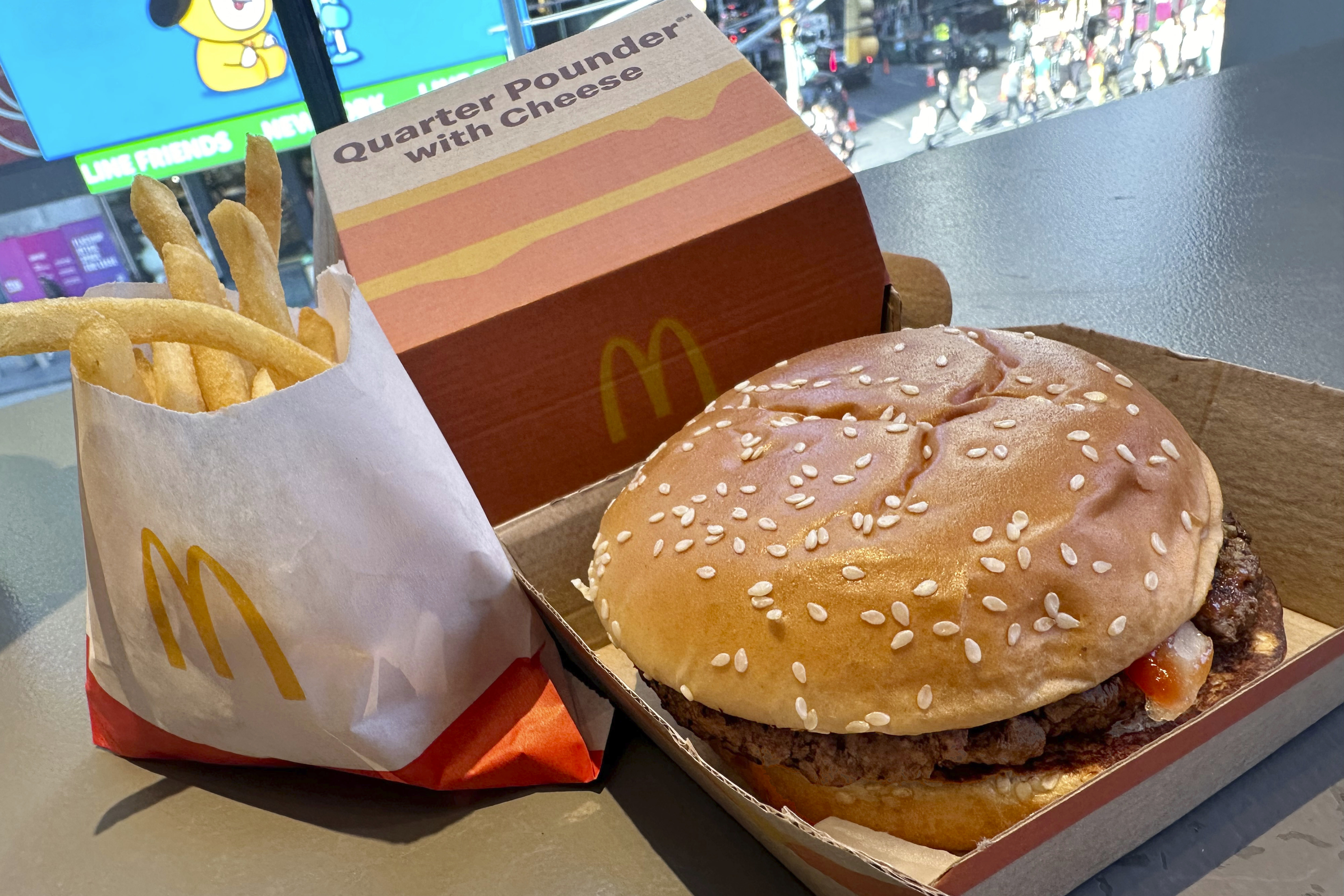 A McDonald's Quarter Pounder hamburger and fries are shown in this photograph, in New York's Times Square, Wednesday, Oct. 23, 2024. (AP Photo/Richard Drew)