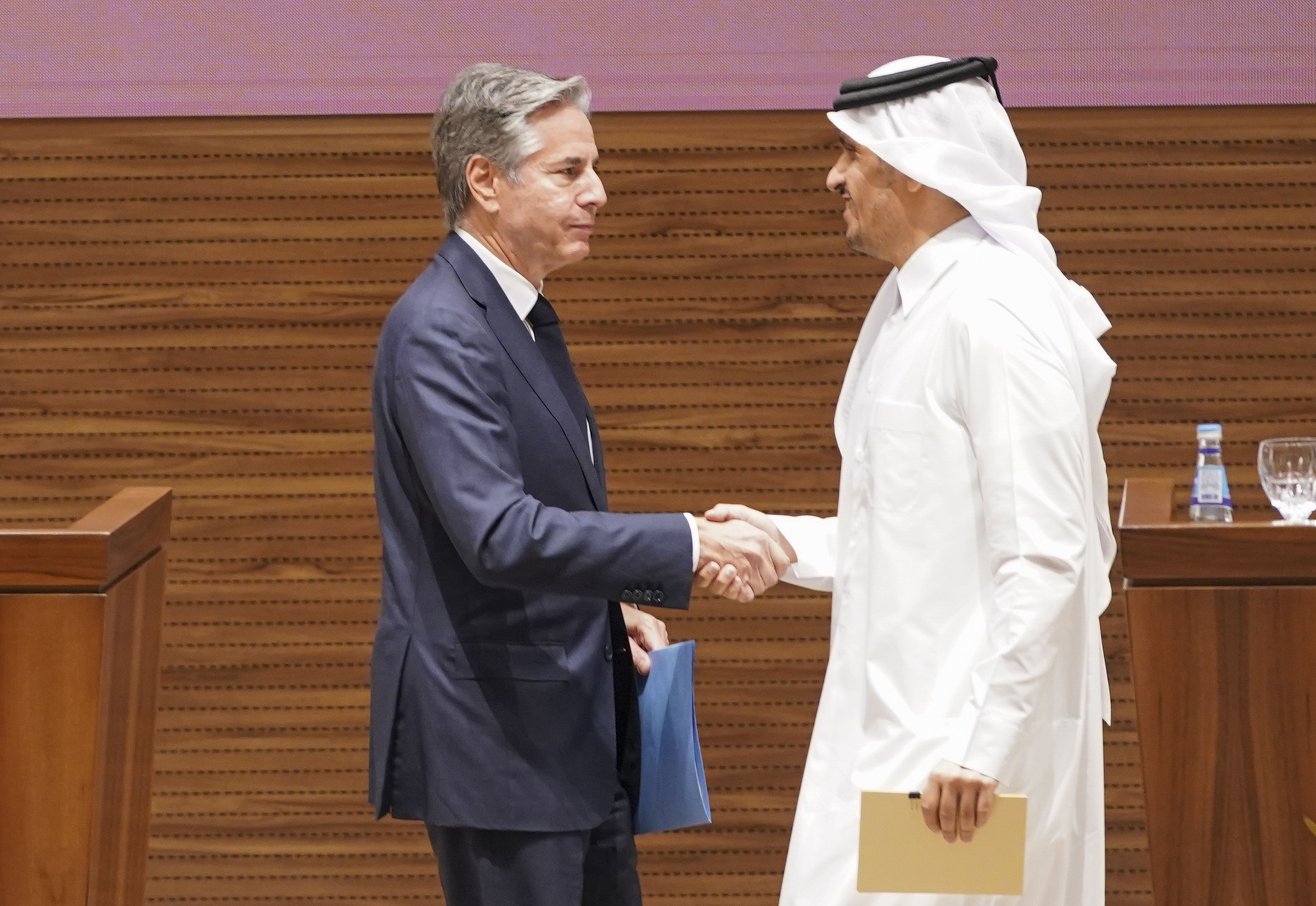 U.S. Secretary of State Antony Blinken, left, and Qatari Prime Minister and Foreign Minister Mohammed bin Abdulrahman Al Thani shake hands as they attend a press conference in Doha, Qatar, Thursday, Oct. 24, 2024. (Nathan Howard/Pool Photo via AP)