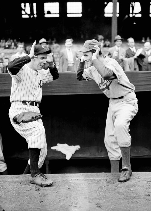 FILE - New York Yankees bat boy Tim Sullivan, left, and Brooklyn Dodgers bat boy Jack Bodner taunt each other as the World Series opened at Yankee Stadium in New York, Oct. 1, 1941. (AP Photo/Tom Sande, File)