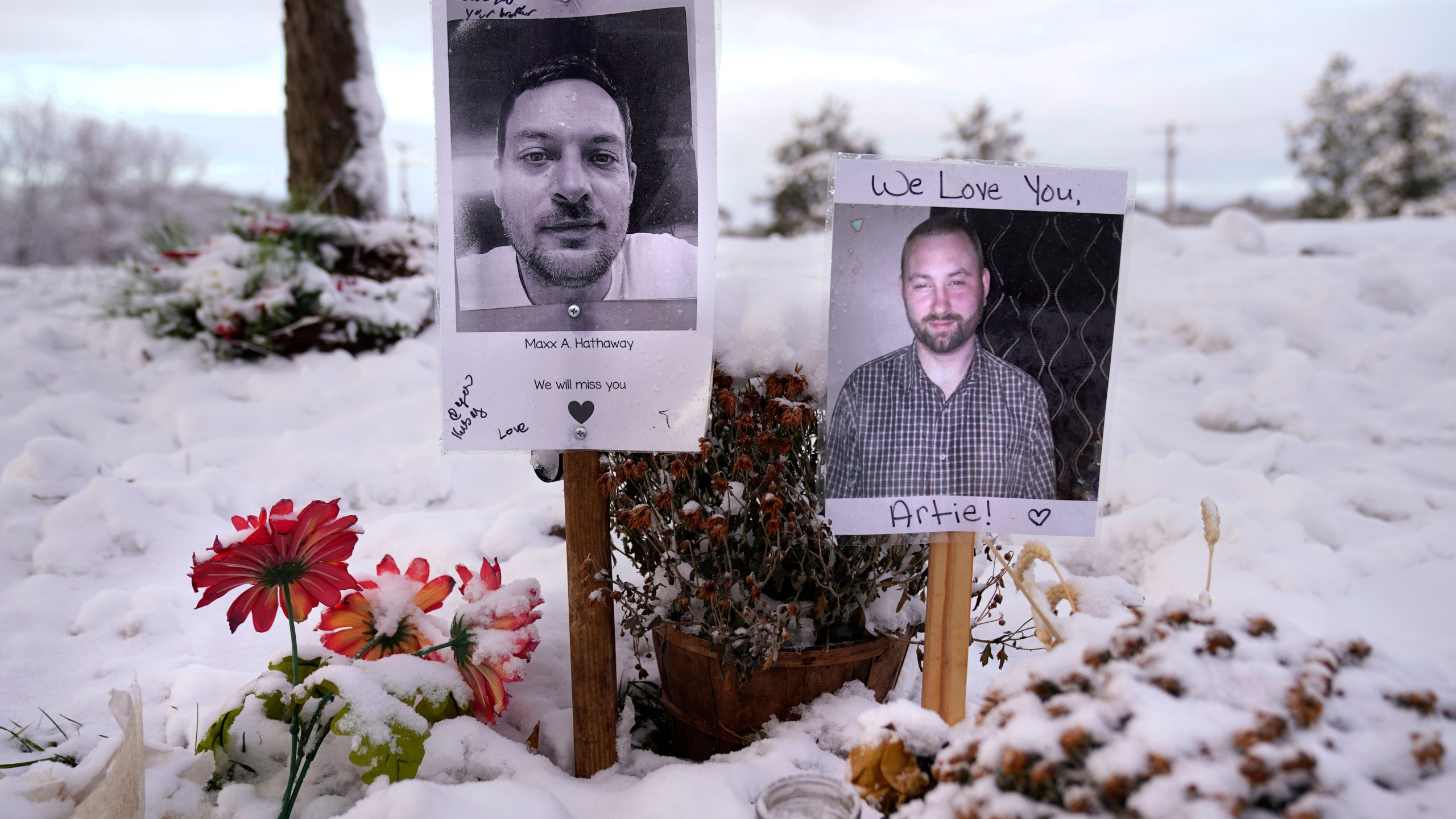 FILE - Pictures of two of the victims of the October 2023 mass shooting by Army reservist Robert Card are seen at a makeshift memorial in Lewiston, Maine, in this Dec. 5, 2023 file photo. (AP Photo/Robert F. Bukaty, File)