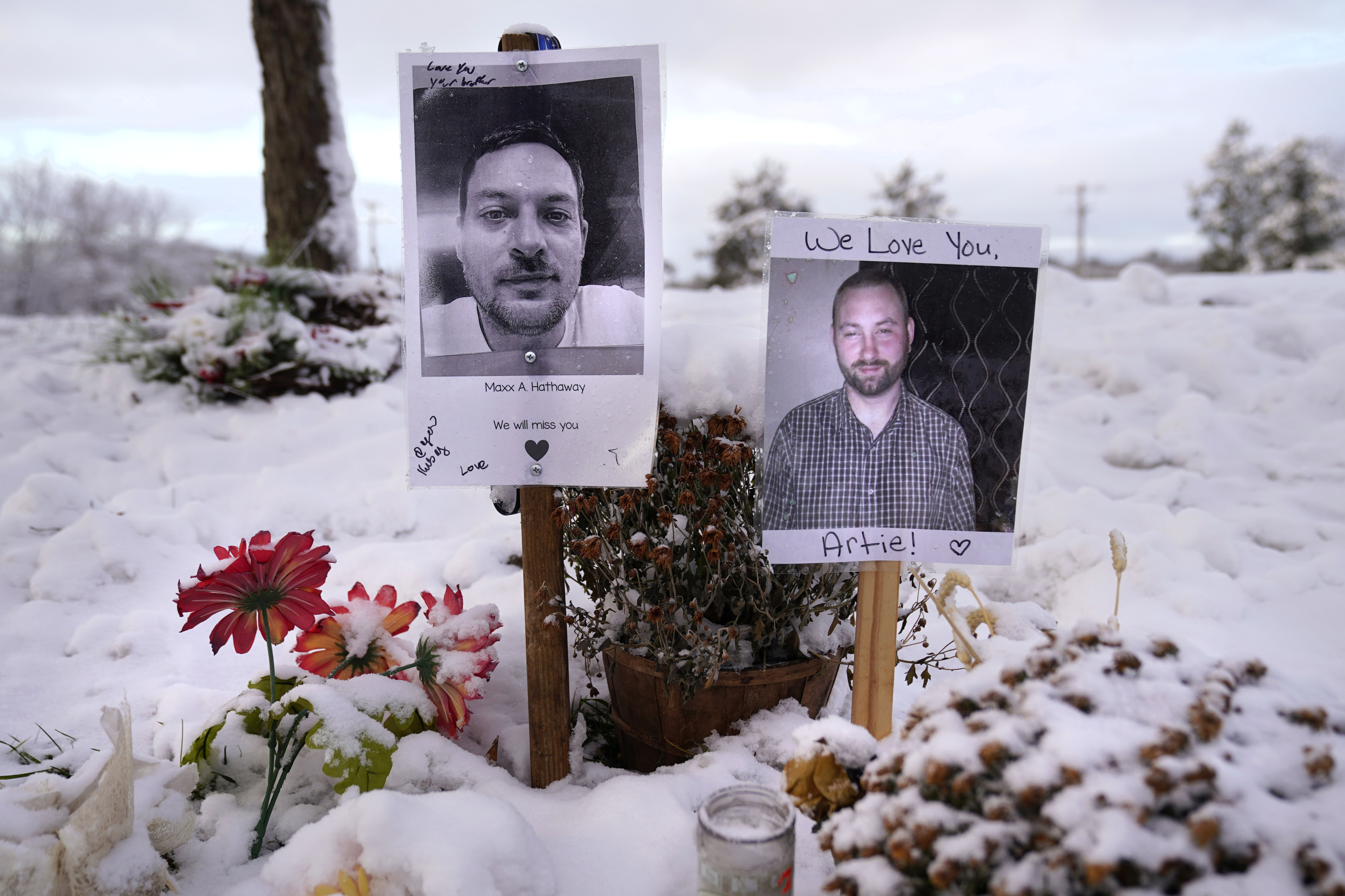 FILE - Pictures of two of the victims of the October 2023 mass shooting by Army reservist Robert Card are seen at a makeshift memorial in Lewiston, Maine, in this Dec. 5, 2023 file photo. (AP Photo/Robert F. Bukaty, File)