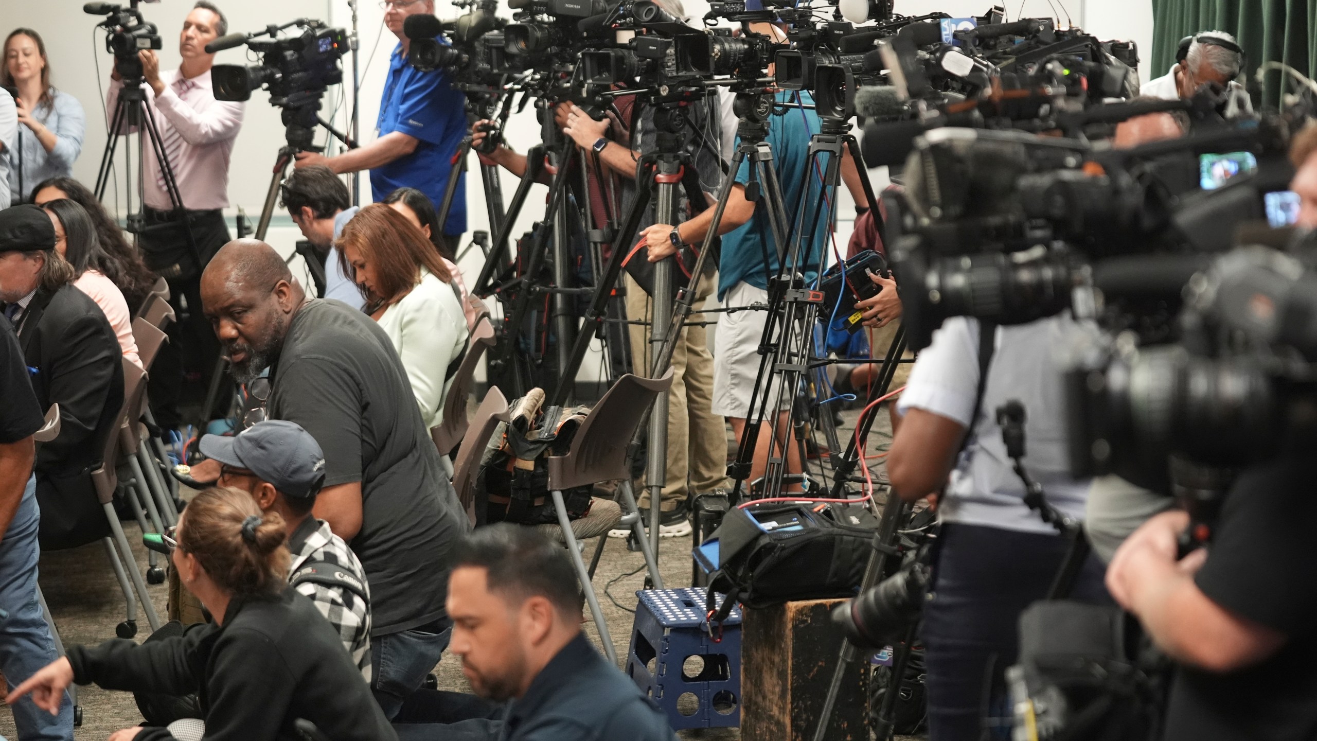 Media gather for a news conference being held by Los Angeles County District Attorney George Gascon on Thursday, Oct. 24, 2024, in Los Angeles. (AP Photo/Damian Dovarganes)