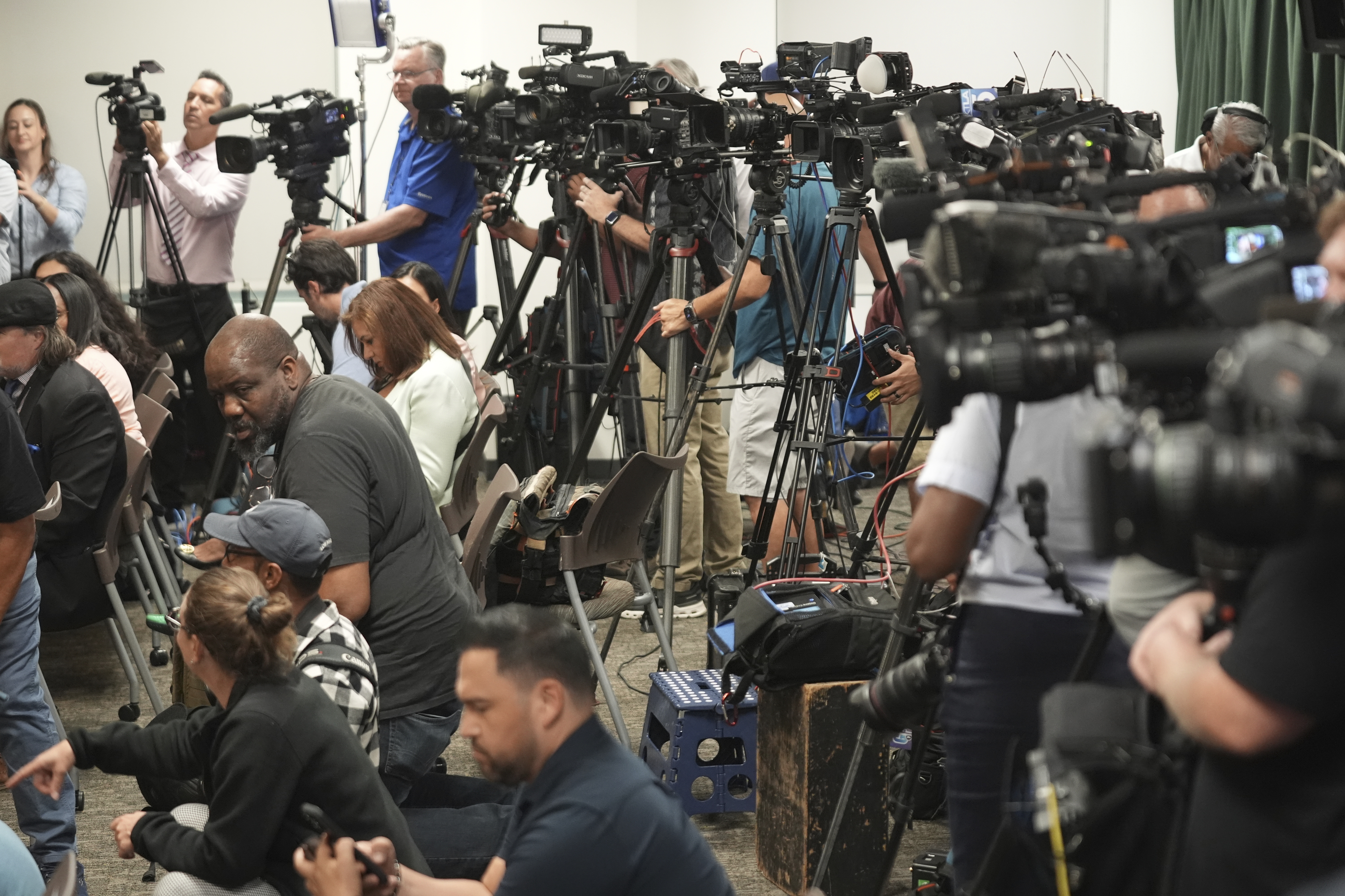 Media gather for a news conference being held by Los Angeles County District Attorney George Gascon on Thursday, Oct. 24, 2024, in Los Angeles. (AP Photo/Damian Dovarganes)