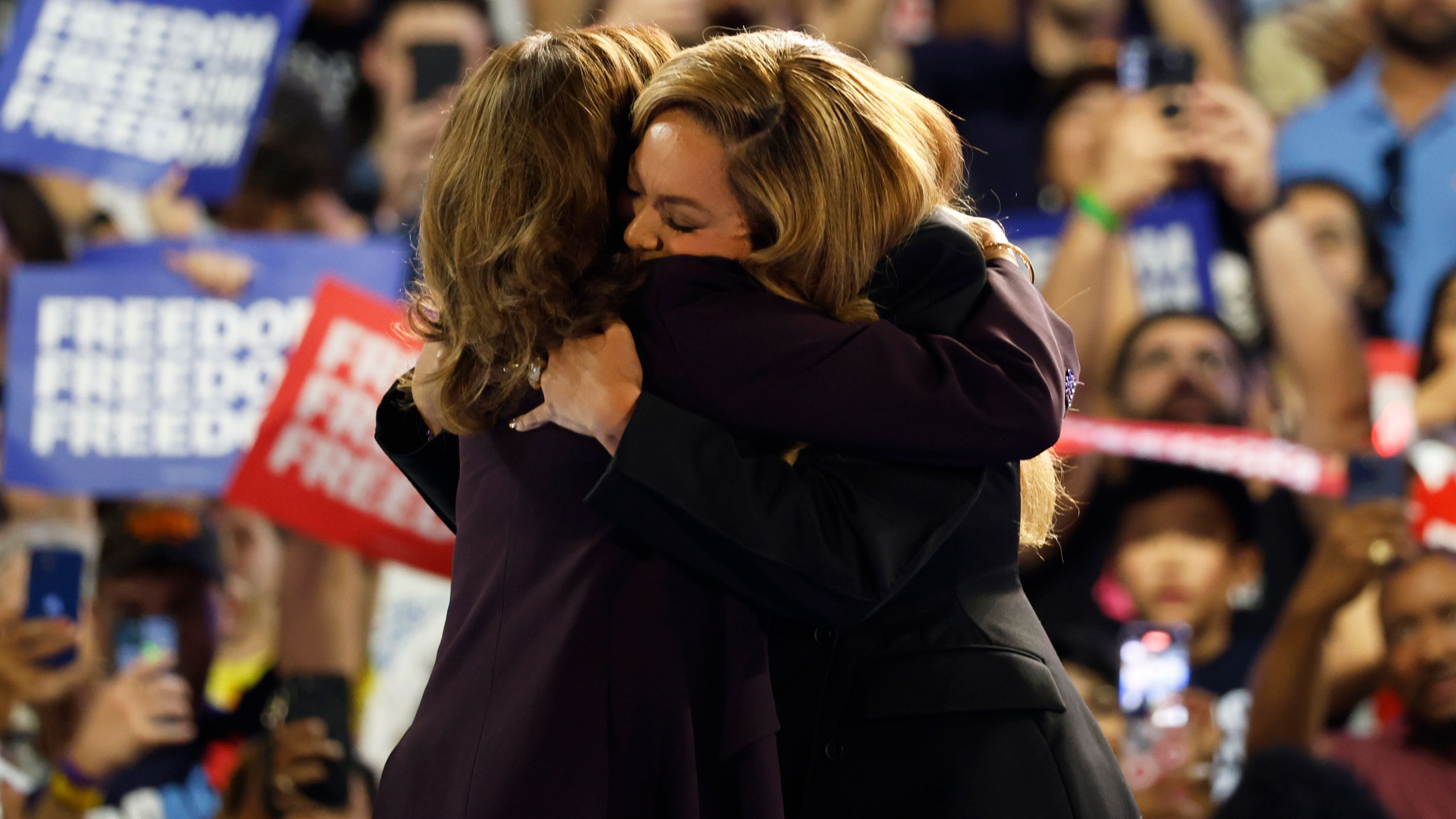 Musical artist Beyonce, right, and Democratic presidential nominee Vice President Kamala Harris, left, embrace on stage during a campaign rally Friday, Oct. 25, 2024, in Houston. (AP Photo/Annie Mulligan)