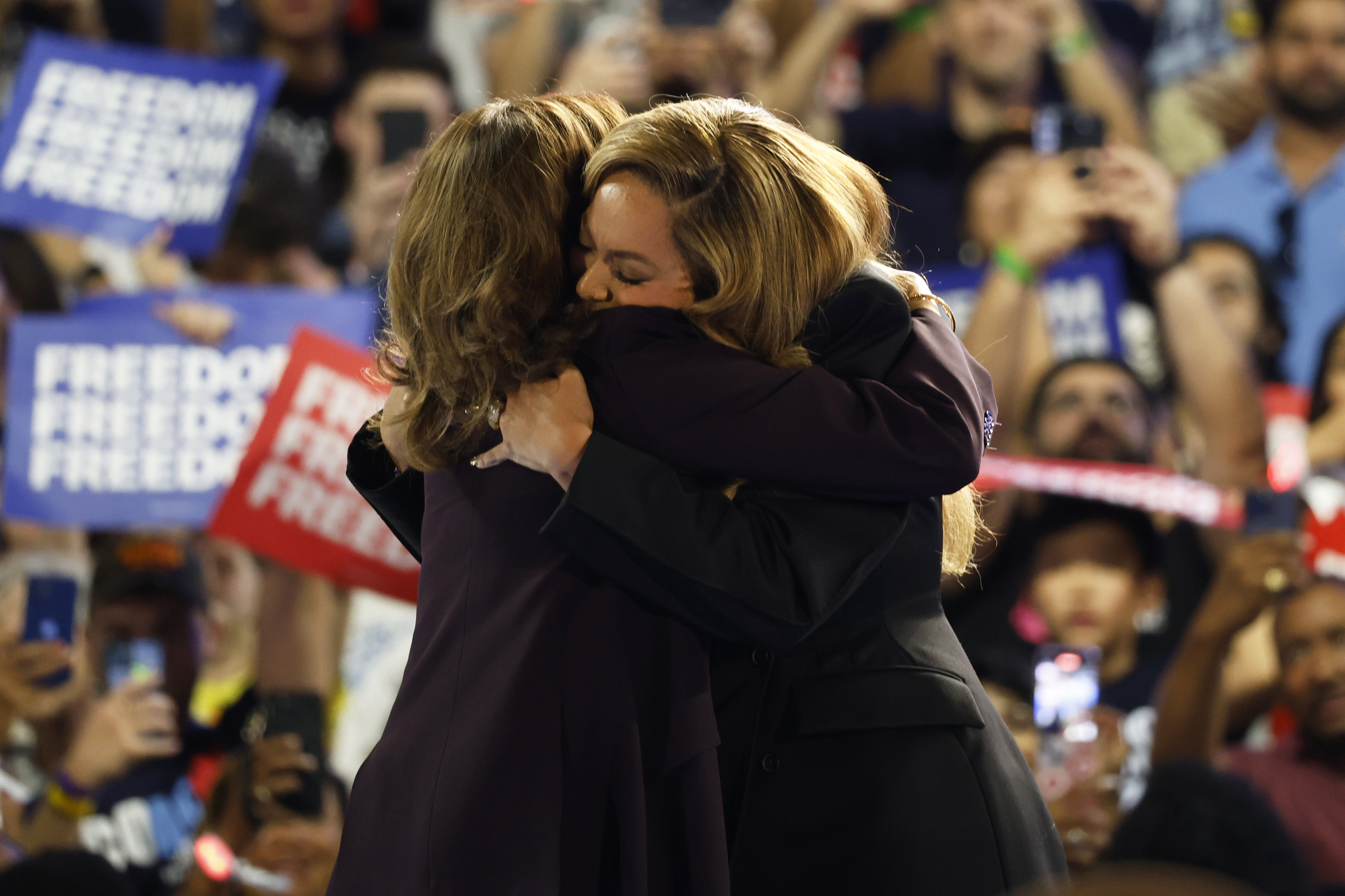 Musical artist Beyonce, right, and Democratic presidential nominee Vice President Kamala Harris, left, embrace on stage during a campaign rally Friday, Oct. 25, 2024, in Houston. (AP Photo/Annie Mulligan)