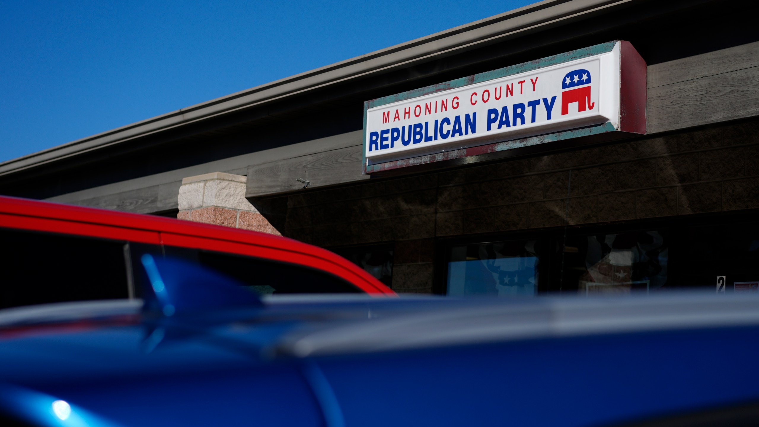 Cars are parked in front of the Mahoning County Republican Party headquarters in Boardman, Ohio, Thursday, Oct. 17, 2024. (AP Photo/Carolyn Kaster)